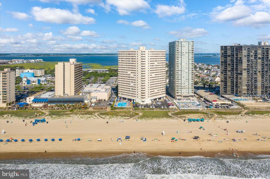 With a stunning oceanfront location this 2-bedroom 2-bathroom condo has been completely remodeled!  Upon entering you will notice the floors are luxury vinyl plank and feature matching baseboard trim for easy cleaning and maintenance.  You will be impressed with the kitchen which has gray shaker style cabinets, granite countertops, and stainless-steel appliances.  The soothing paint colors throughout and abundance of recessed lighting will be appreciated.  Each bathroom has been remodeled with custom tiled showers, new vanities, and lighting.  All interior doors have been replaced and closets upgraded with custom shelves.  This condo delivers fully furnished and ready for Summer 2026!  The Atlantis complex features an outdoor pool, secure lobby, and on-site professional building management.