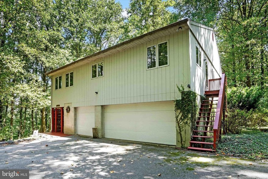 Thank you for considering 2241 Tall Oaks Ln. This is a rare opportunity to own a property that directly borders Rocky Ridge Park, especially one with four acres of land. Built in 1985 by Dorgan and Zuck for the current owners, this unique raised ranch-style home offers a distinctive layout. The lower level features a garage and a small living area, while the main living spaces are located upstairs.  The home includes four bedrooms and 2.5 bathrooms. The fourth bedroom is currently used as a den and has its own exterior entrance to the side yard. Additional features of the property include central vacuum, public water and sewer connections, a 200-amp electric service, and an electric heat pump installed in 2014. The main floor boasts a Keener kitchen and a laundry area. A wood-burning fireplace adds charm and warmth to the house.  One of the highlights of this property is the direct access to Rocky Ridge Park from the backyard, offering endless opportunities for outdoor activities. Imagine spending the day on the park trails and returning home to enjoy your own private land, perfect for hunting or simply enjoying nature. It’s a rare find in Central School District!