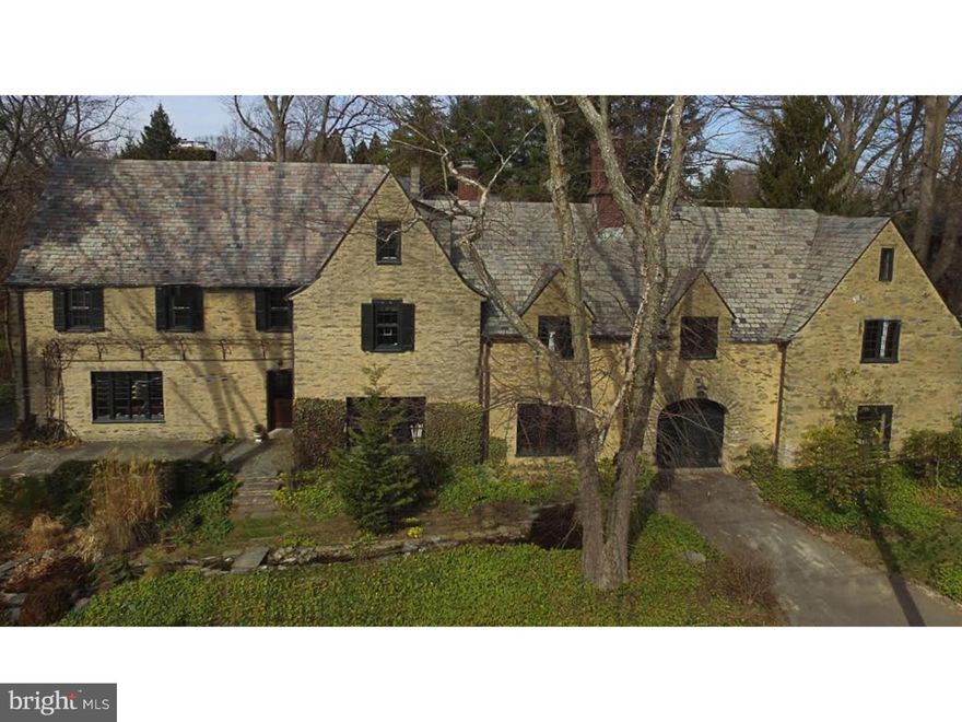 Completely restored French Provincial home crafted of beautiful Wissahickon schist. This spacious home epitomizes the beauty and uniqueness of West Mt. Airy from it's cut-stone construction, lovely stone sills, lintels and an arched entryway that welcomes its visitors into a tranquil courtyard surrounded by sunlit gardens. The homes 7 bedrooms and 4/2 baths reflects a sophisticated lifestyle of comfort, modern amenities and casual elegance. The newly renovated chef's kitchen features a stain glass dome that offers a warm and inviting setting to gather around. Complete with Sub Zero Fridge, Wolf range, wine fridge,  and charming breakfast nook that overlooks the courtyard. The interior spaces of the home focus around a grand entrance hall with a slate staircase & iron railings, flanked by a formal living room, an elegant dining room and a comforting step down den with cork flooring and oak-paneled walls. The floor plan is designed for entertaining and features distinctive fireplaces, wood flooring, and original custom oak molding. The expansive master suite and accompanying bath were recently renovated. The master bath features custom built cabinetry, heated floor and a Kohler digital shower that creates an immersive experience of sound, light and water to start your day.  A wing of the house is ideal for separate quarters for family, guests or an ideal nanny suite. Recent notable additions include: Sauna, Plantation Shutters, Outdoor Stone Kitchen & Patio, New Electrical Service, Digital Nest Thermostats, Digital Door Lock and Wired Sound System throughout the first floor.  The spectacular grounds feature a canopy of mature trees, a fabulous flagstone terrace overlooking the newly added sunken garden/lawn & courtyard, outdoor kitchen, serene gardens and a stream which connects two lily pond with fish.  The house is located within walking distance to Weavers Way, Septa train lines,  and hiking trails within the Wissahickon park & Carpenters woods. Quick access to Center City via Lincoln Dive. What an opportunity to live in a turnkey home in a prime location!