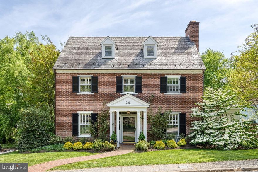 Welcome to this quintessential Homeland brick colonial home, beautifully updated for modern living while retaining timeless charm. This home offers fantastic living spaces, including a sunny and spacious family room addition, a versatile sun porch perfect for a home office, and a beautiful living room with built-in shelving and fireplace. The heart of the home—the kitchen—has been significantly upgraded with a new Sub-Zero refrigerator, high-end appliances, new counters, a peninsula for casual dining, and a stylish new backsplash. The kitchen has been opened to the dining room, creating a bright, seamless flow for everyday living and entertaining. A centrally located first floor powder room adds to the convenience of it all. Upstairs, the primary bedroom is a true retreat with an upscale built-in closet system, cozy window seat, and a renovated, expanded en-suite bathroom. Four additional bedrooms provide ample space, complemented by updated bathrooms and well-maintained, recent systems throughout the home. The lower level offers a club room for play and exercise.  Step outside to enjoy the large, flat, and fully fenced backyard—ideal for play, entertaining, or gardening. A charming patio with an awning creates a perfect outdoor gathering spot, and the detached garage adds convenience and storage. This home offers the best of Homeland: classic elegance with smart, stylish upgrades in a prime location... just steps from the Lakes!