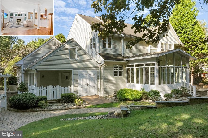 Superb location, property and opportunity at 1955 Severn Grove Road. Conveniently located on a very private, 1-acre lot, this 5-bedroom colonial has everything you’ve been looking for in a home! The gracious foyer with hardwood floors opens to the library on the left and a light-filled living room ahead. The living room has a gas fireplace as the focal point, with ample windows giving landscaped garden views. One of the striking features of the home is the oak staircase that wraps around the 20 ft foyer with an overlook. Architectural columns provide definition for the open floor-plan, allowing easy transitions but also providing a sense of space to each room. 
The incredible gourmet kitchen is a chef’s delight with cherry cabinets and stainless steel appliances, including a double wall oven with warming drawer, Jenn-Aire cooktop, and side-by-side refrigerator. There is a breakfast bar as well as space for a separate table with garden views. Off the kitchen, the mudroom has a laundry center, trash compactor, and additional cabinetry. The formal dining room has chair-rail and crown molding, and a lovely chandelier. The main level also offers an office, with built-in aquarium and garden views, and a powder room. Step into the year-round sunroom and enjoy the tranquility of the extensive gardens. Beyond is a beautiful paver patio with complementary stone retaining walls.
The primary bedroom suite upstairs has a commanding view of the gardens and includes a large bedroom, fully-outfitted separate walk-in closets, and a truly spa-like bathroom. The primary bath has separate vanities, with tons of cabinet space, a jetted tub, and an oversized shower with multiple showerheads and sprays. The second and third bedrooms share a remodeled bathroom with pretty pebble finish flooring. The third bedroom has a built-in desk, dresser, and currently there’s a stackable washer/dryer in the closet. The fourth bedroom includes an ensuite bathroom and custom built-in cabinets. The lower level has 9 ft ceilings and features a gorgeous kitchenette with fridge, ice-maker, and cappuccino machine. So many possibilities on this level! There is a bedroom, full bathroom, and huge theater room in addition to the family room. The theater room would be the perfect spot for big comfy chairs. For those needing a separate living space for family or friends, this would certainly be the top choice. There is also a room with built-in cabinetry for extra storage, as well as an office space or hobby room.
Outside, the many garden areas will give hours of pleasure. The peacefulness of the waterfall and the privacy under the trees will transport your mind to a quieter place. The current owner used the garage for a home-based business, but it would be easy to return the space to the two-car garage that it was originally.