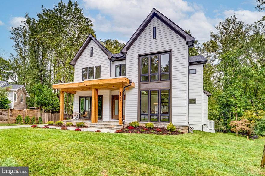 Contemporary yet timeless...with hints of the craftsman architectural style but paired with contemporary lighting and fixtures, 107 Yeonas Circle is spectacular. This brand new home built by a luxury home builder CDB Design & Build  boasts 6 bedrooms,   6 full baths, 2 powder rooms, and 6,486 square feet.  This home is spacious with a flowing floor plan.  CDB Builders spared no expense to ensure that the concept of living well is felt boldly by its new owner.

View the outside from within in your living room.  Regardless of warm or colder weather, your view to the wooded lot through the impressive windows brings a serenity richly deserved.  Open to the kitchen, you won't miss a beat.  The gas fireplace and custom built-ins are the centerpiece of this room. 

A Gourmet Kitchen to serve the chef or home cook.   Well appointed with JennAir® appliances that include Pro-Style 6-burner gas range with side by side ovens, additional electric wall oven, microwave, refrigerator and dishwasher.  42" dovetailed, soft close Vita Cabinetry® rounds out this beautiful kitchen.  Complimenting the space are an expansive island and walk-in pantry.  Flanking the kitchen are the garage and mudroom.  

Perfect for gatherings, your light-filled dining room is outfitted with custom built-in shelving, bar and a beverage refrigerator.  Floor to ceiling windows let the light pour in and the tray ceiling adds another layer of sophistication not seen in the average build.

Space and Serenity, are the key words for the primary suite.  Picture windows and a private balcony look out to the wooded lot.  Outfitted with dual walk-in custom closets, tray ceiling and recessed lighting you couldn't ask for more in your place for rest and relaxation.  

Magazine worthy...this primary bathroom goes all out. Two expansive vanities are on opposite sides  of one another (each with their own water closet).  The centerpiece being the stand alone soaking tub and rain shower big enough for two.  If you are looking for a spa experience at home, look no further. 

Lower level living is done to perfection at 107 Yeonas Circle.  Equipped with a media room fit for the coveted home theater, spacious recreation room outfitted with wet bar, built-ins, bar seating, powder room, and a bedroom with en-suite bathroom...this level leaves nothing to be desired.  Walk out to your back yard or enjoy the light coming through the picture windows.