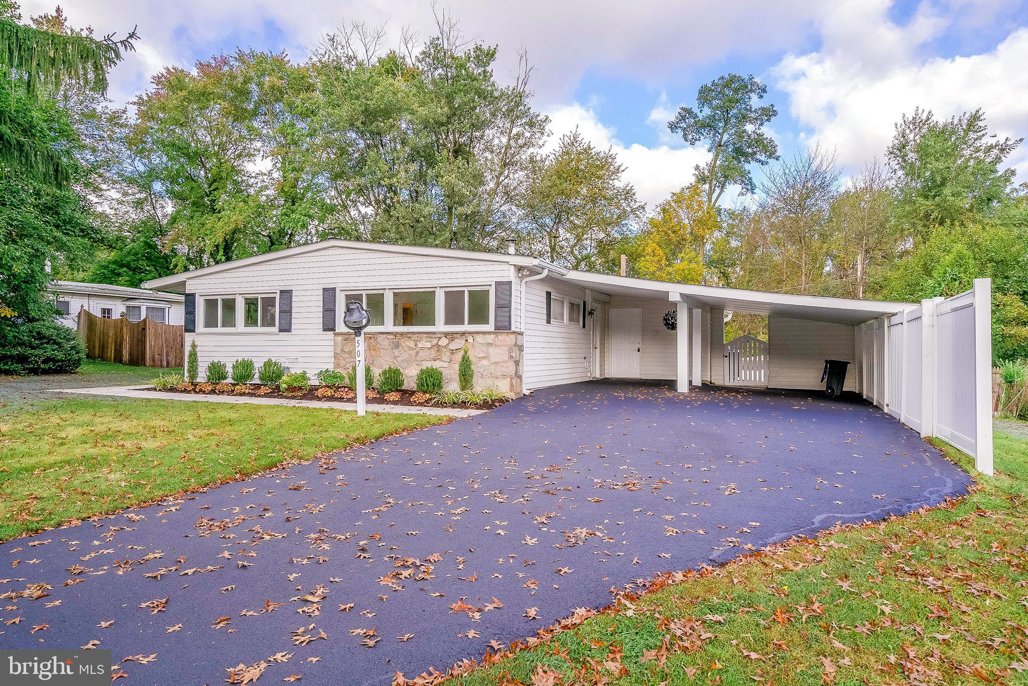 Don't miss out on this charming rancher in the very popular Greystone Manor neighborhood in picturesque Whitpain Township. Wissahickon School District.  As you pull up front, you will appreciate the "curb" appeal this home offers, with updated landscaping and two car attached carport. The side entrance from the carport leads to the wonderful kitchen with new granite counter tops & fixtures, upgraded flooring, & white cabinets . The kitchen flows into the spacious living room & dining area with brand new neutral carpets, vaulted ceilings w/ exposed beams, wood burning fireplace and entrance to covered rear patio. The center hall leads to the two guest bedrooms, each with with fresh paint  and  new carpets, the full hall bathroom & the main bedroom with new carpets, fresh paint, double closets and its own private half bath. The exterior offers  a nice storage room just off the kitchen.  The backyard setting includes the lovely covered porch and plenty of room to play & entertain in the yard.  Seller installed a new HVAC system in 2019. New grass seed planted throughout the yard. This home is conveniently located five minutes from the Ambler train station, downtown Ambler borough dining and the Route 309 Expressway. Quick Settlement Possible.