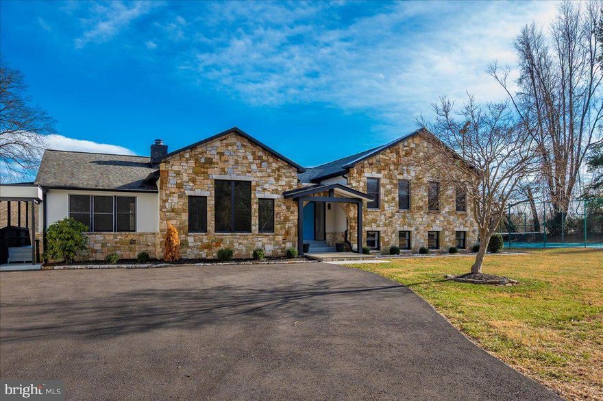 Tucked away on nearly five acres, this expansive  home offers a rare opportunity for buyers seeking space, privacy, and a property that truly stands apart from typical neighborhood construction. Thoughtfully remodeled, the residence delivers a bright, open layout with abundant natural light, a beautifully updated kitchen, spa-inspired baths, hardwood flooring, and modern lighting throughout — creating an easy flow for everyday living and entertaining alike.

The main residence offers a highly functional layout with four bedrooms on the upper level and two additional bedrooms on the lower level. The kitchen has a beautiful view of the land and the sliding glass doors open to expansive deck. The lower level has two bedrooms, a full bath and a large rec room that opens to the indoor pool/hot tub that makes this property truly unique  In addition, a fully separate guesthouse includes its own private entrance, laundry, kitchenette, bedroom, and full bath — ideal for extended guests, au pair living, or potential rental use (buyer to verify).

Designed for both recreation and relaxation, the property includes an indoor pool and hot tub, private tennis court, expansive deck, and generous open grounds ideal for gatherings or quiet retreat.

Major systems have been well maintained, including roofs replaced in 2018, 2019 electrical system and  Water Heater, 2017 HVAC,  well inspection in 2021, and septic inspection and pump completed in September 2023. Geothermal system dates to 1990.

Conveniently located approximately 30 minutes from Washington, DC and within the Northwest High School cluster, this is an exceptional offering for buyers who value land, privacy, and a one-of-a-kind home rather than a cookie-cutter subdivision property. Private showings available by appointment.