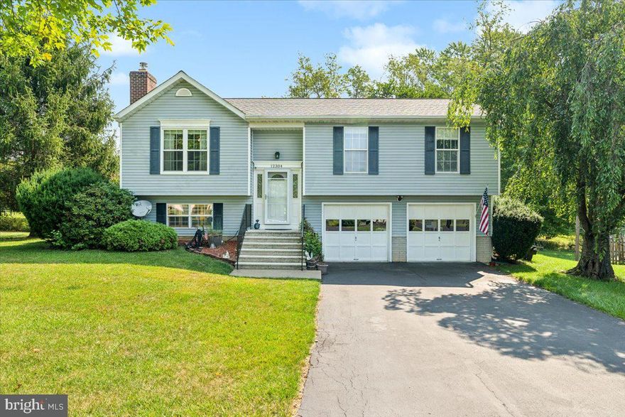 Welcome home to 12304 Cracked Bell Court! This stunning 3 bedroom, 3 bathroom house boasts beautiful flooring in the kitchen, living room, and hallways, a cozy woodstove, and a family room perfect for entertaining. The beautiful view from the freshly painted deck will take your breath away every morning as you enjoy your coffee. With a new heat pump and a spacious two car garage, this home has everything you've been looking for. Don't miss out on the opportunity to make this house your forever home!