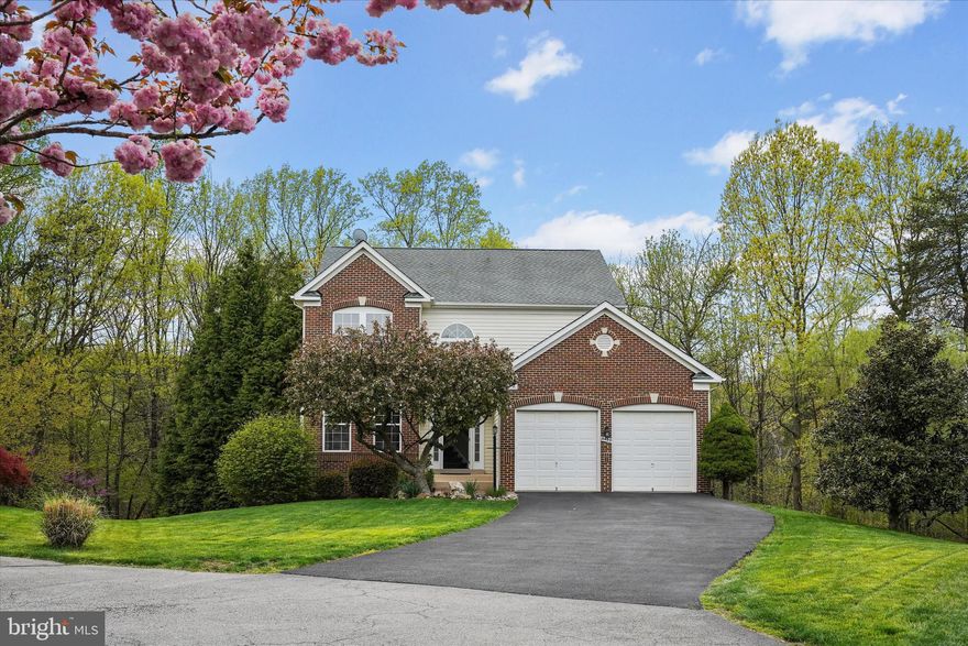 Escape to your own private oasis in this stunning, move-in ready home nestled at the end of a private drive. Located in the heart of a quiet, sought-after community in Springfield, this spectacular 5-bedroom, 3.5 bath open-concept residence backs to a tree preserve and offers 3,801 square feet of beautifully designed living space. Step inside the majestic two-story foyer to find brand new flooring flowing throughout the main level, complemented by sophisticated crown moulding, stylish upgrades, and a dual staircase. The spacious office on the main floor provides a quiet retreat for work-from-home days, while the inviting gas fireplace with mantle in the family room creates a cozy focal point in the living area. The formal living room and adjoining dining room with a large bay window offer a warm and inviting space to relax. The open-concept kitchen is a chef’s dream, featuring granite countertops, stainless steel appliances, a breakfast area, and walkout access through French doors to a huge porch with vaulted ceilings and a rear deck—perfect for entertaining and taking in nature! Upstairs, the spacious primary suite boasts vaulted ceilings, a luxurious en-suite bath with a huge, custom-designed walk-in shower, dual vanities, a separate vanity table area, and a large walk-in closet. Three additional bedrooms and a newly renovated bath complete the upper level. The lower level features a walk-out basement, generous recreation room, a fifth bedroom, a full bath, and a brand new laundry room. Modern upgrades include a 2019 gas HVAC system and a new tankless water heater for endless hot water. The HOA includes access to two tot-lot playgrounds, basketball courts, twice-a-week trash service, weekly recycling, and seasonal leaf pickup. Conveniently located with easy access to I-395, I-495, I-95, DC, VRE, Fairfax County Parkway, and Fort Belvoir. Commuters will love the short drive to the Gambrill Road Park & Ride Lot for Metro access to DC and the Pentagon. This is a rare gem that exudes peace and tranquility. Don’t miss your opportunity to own this exceptional property.