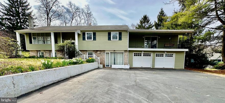 Welcome to 2021 Young Road! Situated on a beautiful 1.5-acre lot, this 4 bedroom, 2 1/2 bathroom with 2-car attached garage is located in the desirable Owen J Roberts school district; And with a fresh coat of paint on the walls, this home is a clean canvas just ready for your imagination. With over 1900 square ft on the upper level and 900 on the bottom level you’ll see that there is plenty of room for a family to spread out. As a traditional split-level, just come up the stairs right into the spacious living room, which features a garden window and a large bay window as well both letting in plenty of natural light. Off to the right is your formal dining room, and just around the corner is the kitchen. The kitchen has plenty of countertops and cabinet space.

On the  upper floor there’s a full hall bathroom and 2 nice-sized bedrooms. You must go through the 3rd bedroom to get to the 4th which is the primary suite. So bedrooms 3 and 4 are in tandem and the front could be used as a baby room or sitting room. This primary has a ton of space with two massive walk-in closets and it’s full ensuite bath with Jacuzzi tub. In the primary bath, the ceiling vent doubles as a heater as well. The primary bedroom also has its own large Juliet deck with porch swing.

The basement has a large family room sporting a massive wood stove for those cold winter nights. Even though the wood stove is in the basement, there is a 1st floor register with an electric fan to draw heat right into the living room. Just off the family room is a powder room for your convenience. There are slider doors so you can head out back to your concrete patio. There is a large laundry-room area, and another room off to the front that could serve as an office or even a 5th bedroom. Even further down is a nice-sized bar room area featuring another set of double slider doors, leading out to the front driveway which has parking for at least 4 cars. Just beyond the bar room is your two-car garage, and behind the two-car garage there is a nice workman’s shop. Outback you have a covered area for all your lawn equipment. Now on to this beautiful 1.5-acre lot! In the back yard you have a Gazebo and shed and just beyond that you have a huge private yard enclosed with mature evergreen trees. This awesome lot is very hard to find in this price point. This ideal location gives the feeling of being quietly removed with great star gazing yet still convenient to routes 100, 422, and the PA Turnpike with easy access to restaurants, shopping centers, St. Peter’s Village, Phoenixville, Warwick County Park, French Creek State Park, and Camp Innabah or Sankanac. Book your tour today before it’s gone!