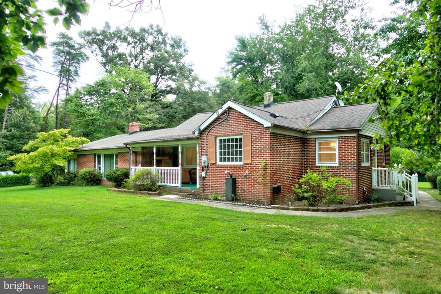 Estate property – sold AS IS – move-in ready! This almost entirely brick 3-bedroom, 2-bath rambler offers spacious single-level living in a serene rural setting. The large kitchen has been partially updated and features a large granite island that opens to a cozy family room—perfect for hosting friends or enjoying quiet evenings.  The adjacent formal dining and oversized living room provide ample space to entertain. Off the living area, the 2-sided glass-enclosed patio with a wood-burning stove adds year-round comfort and charm. The main bedroom includes an en suite bath and large walk-in closet. Hardwood floors are exposed in some areas and also exist beneath carpeted areas throughout.  Enjoy morning sunrises from the east-facing deck and sunsets from the covered front porch. The circular driveway provides plenty of parking. A large storage shed adds value.  The roof was replaced in 2017.  A few minute’s drive to fishing, boating, and hiking. Located less than 5 minutes from Nanjemoy Country Store and  local Community Center. Conveniently located just 20 minutes to La Plata and 30 minutes to Waldorf.  Agent is related to seller.  Photos coming soon.