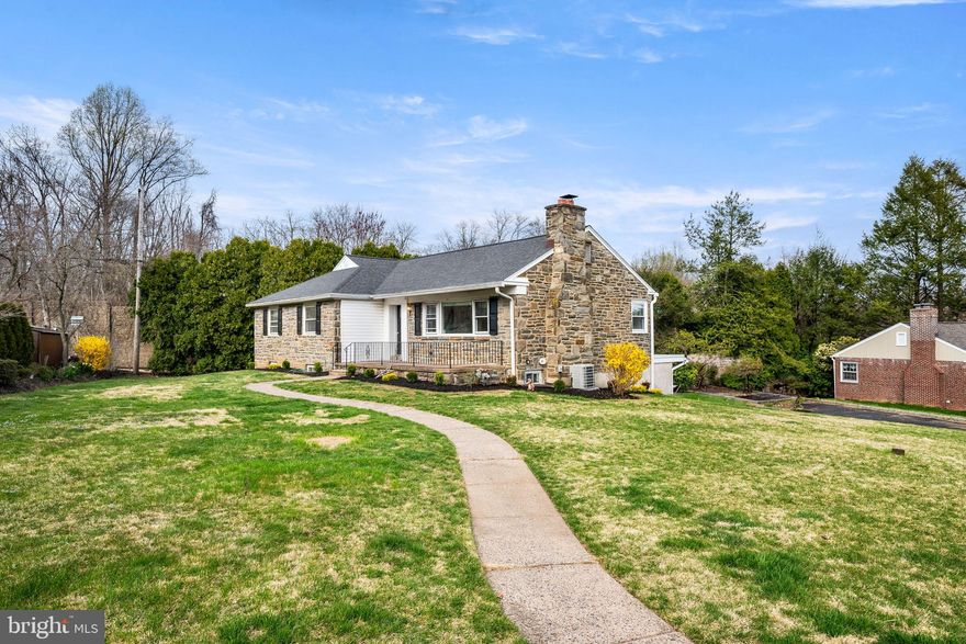 332 Crestview Circle is a lovely 1950’s solid stone ranch style home located within the very desirable and award winning Wallingford Swarthmore School District. This four bedroom, two and a half bath home provides a one level living that is more accessible and sustainable for people of different ages and abilities. The house welcomes you with a pleasant wide front patio, the perfect spot to seat and enjoy the outdoors. The living room is spacious with hardwood floors, a large picture window, and a wood burning fireplace. The dining room area, with hardwood floors, has a set of corner windows that provide pleasant ambient light. The kitchen has room for a breakfast nook and it is ready to be transformed into your dream kitchen. The large primary bedroom has double closets and an en suite bathroom with tile floors, wainscotting throughout and a round corner shower. The two other bedrooms located in the main floor are well sized and have hardwood floors. The hall bathroom with wainscoting walls and tile floors is designed with a low threshold shower and a marble top vanity with a farm style sink. The basement was finished with a generously sized room that is perfect for an entertainment room or a family room. The basement also has an oversized bedroom with an emergency exit window. A separate room contains the laundry facility, and extra space for a small home office, and a half bathroom. The house has been recently renovated with a new roof and front door installed in February 2024. Both full size bathrooms in the main floor were remodeled in November of 2021. The basement was also finished in November of 2021. New washer and dryer were installed in 2024. The home is conveniently located with easy access to shopping, the Borough of Media and Swarthmore. It also provides a short commute to the City of Philadelphia and the Philadelphia International Airport.