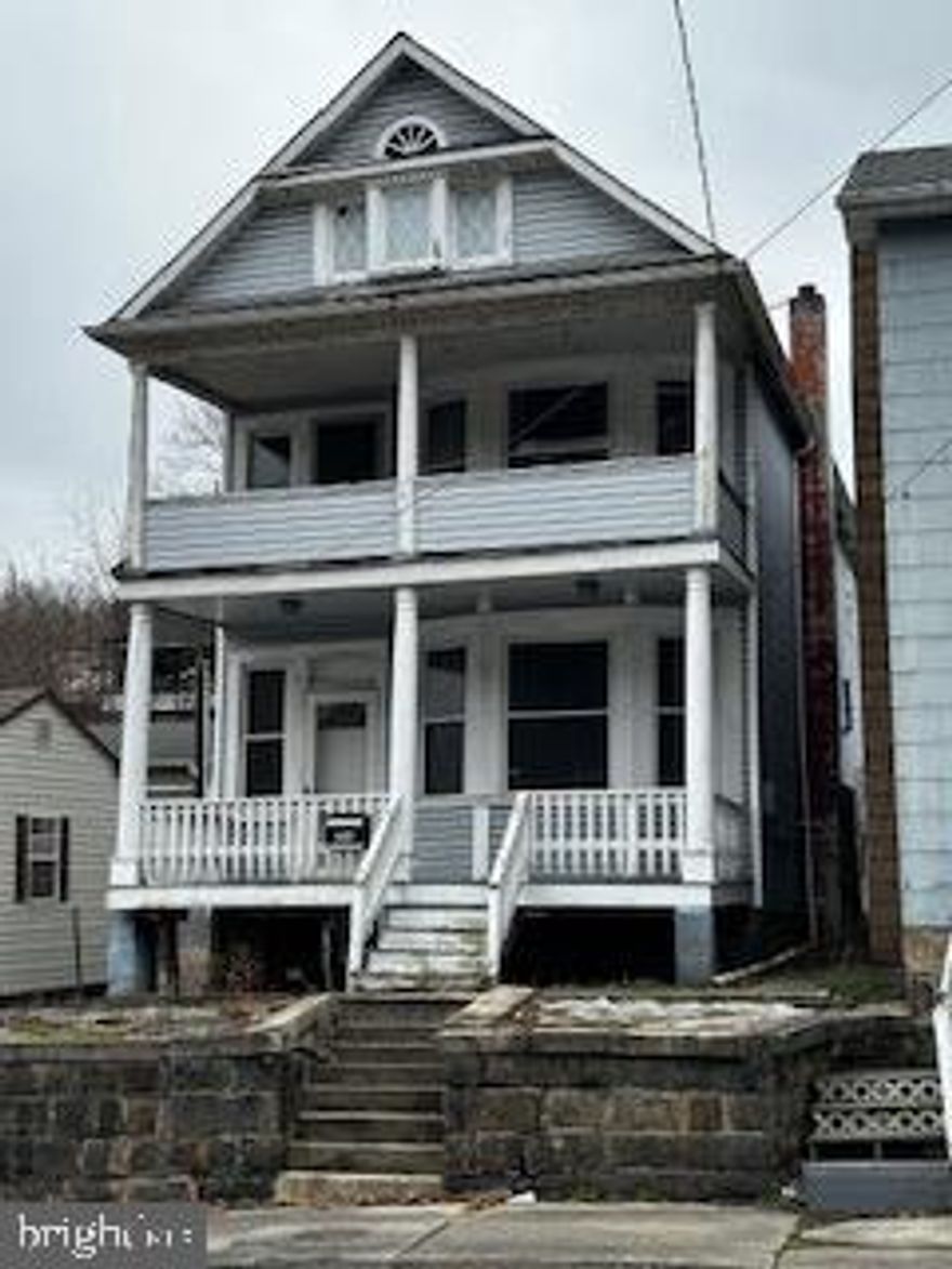 LARGE FAMILIES WELCOME IN THIS 4 BEDROOM CONVENTIONAL HOME WITH 3 LEVELS OF LIVING SPACE .  LARGE FOYER W CHERRY BANISTER TRIM.  KITCHEN W NEW COUNTERTOPS INSTALLED IN 2018, NEWER CABINETS, DROP CEILING, DISHWASHER & GAS OVEN/RANGE AND HARDWOOD FLOORS.  LIVING ROOM INCLUDES TEX CEILNG, FIREPLACE AND OAK WARDWOOD FLOORS.  SEPARATE DINING ROOM WITH CEILING FAN/LIGHT & H-WOOD FLOORS.  6 X 11 LAUNDRY ROOM, ½ BATH W NEWER TOILET, DROP CEILING & H-WOOD FLOORS. 2ND FLOOR OFFERS 3 BEDROOMS WITH CARPET (HARDWOOD FLOORS UNDERNEATH), 4’ WAINSCOTTING, PLASTER & WOOD PANEL WALLS.  SMALL OFFICE W LINOLEUM FLOOR AND FULL BATH W TEX CEILNG, 18 X 7 BALCONY.  ATTIC OR THIRD FLOOR INCLUDES 4TH BEDROOM W DRYWALL, CARPET AND SKYLIGHT, 12’ X 25’ UNFINISHED STORAGE SPACE.  ADDITIONAL FEATURES:  NATURAL GAS HEAT, CITY WATER & SEWER, 3’ WAINSCOTTING THRU OUT, HARDWOOD FLOORS THRU OUT, ALL NEW WINDOWS THRU OUT, MAINTENANCE FREE EXTERIOR AND SHINGLE ROOF.