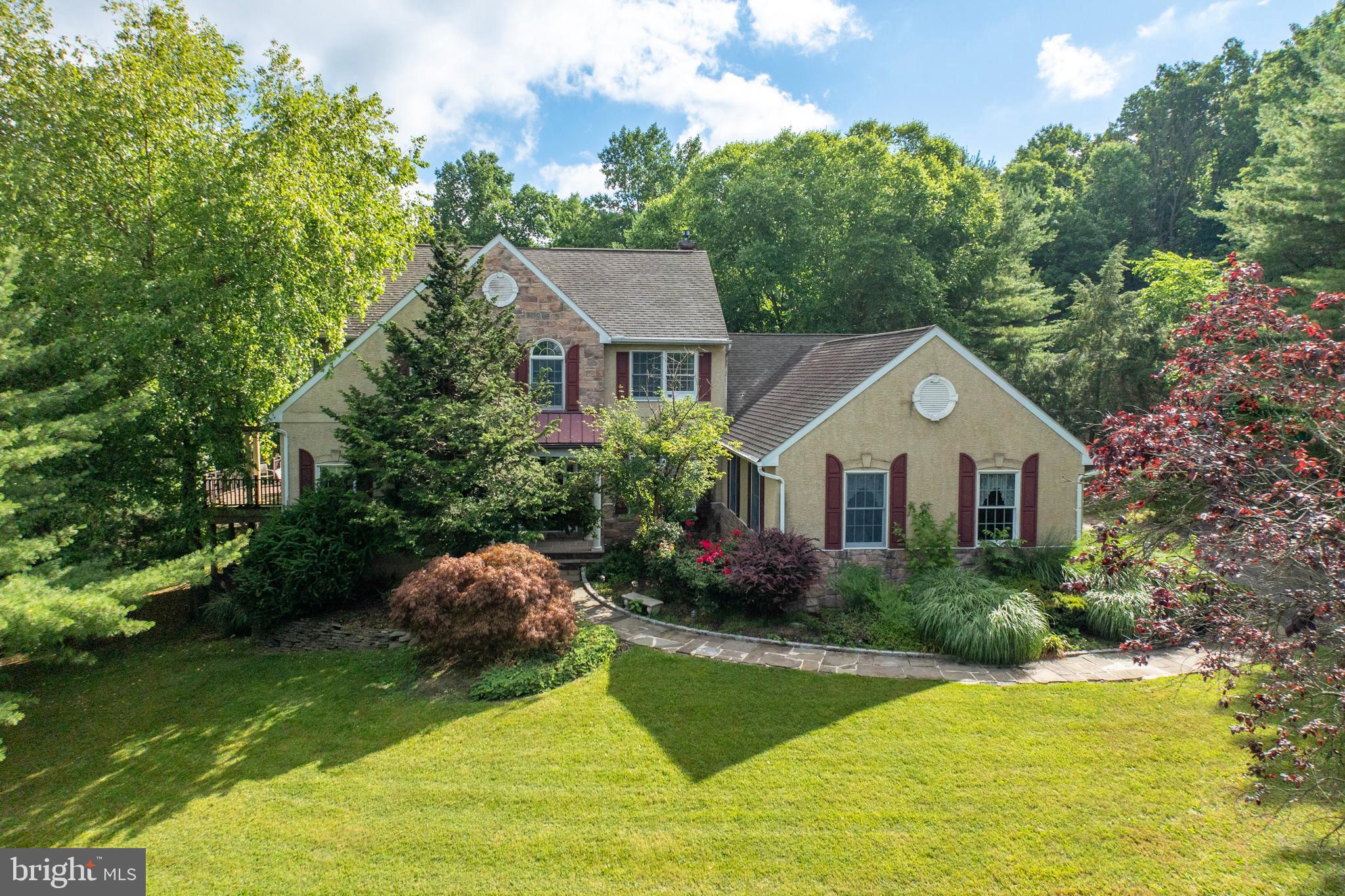 Welcome to 4050 Prospect Hill Ln. Nestled at the end of a quiet cul-de-sac peace and tranquility await. At over 6300 sq ft of living space and situated on over 4 acres, your Oasis awaits. With 5 beds 3 full and 2 half baths, space should not be a concern. Perfect for an expanding family or one in need of extra space for in law quarters, this home has the ability to fit your needs. Upon entering the front door into the foyer you will begin to see what this custom built home offers. Hardwood floors lead you to the entrance of the library as well as a formal living room. You're also led into the massive two story family room, lit up with natural light from the wall of windows. This room also features custom woodwork, a 2 sided fireplace and a granite countered wet bar.Off the family room is the breakfast room, complete with vaulted ceilings and skylights, a perfect place to start the day. A full kitchen, with 42' cabinets and granite countertops make for the perfect place for meal prep and the attached dining room make serving those meals convenient.Down the hall you find the 1st floor master suite, complete with 2 walk in closets and fireplace and a full master bath with separate shower and bathtub.. Further down the hall is a powder room as well a laundry/mud room and side entrance. Upstairs 3 generously sized bedrooms, a full bathroom are found as well as a loft area which overlooks that magnificent family room. Back downstairs to the lower level and you enter a full finished area with it's own private entrance as well. A beautiful, full kitchen, complete with granite counters and an island. Another bedroom, a gym, a game area, a full bath, and a half bath all make up this area as well as a bonus ! A home theater featuring a 12 zoned digital sound system. If being outdoors is more your thing, this property will not disappoint. Out back over 4 acres of nature's beauty, full of beautiful trees and landscaping promote peace and tranquility and highlight the features of the Koi pond and waterfall. A gazebo adorns the patio and a deck that connects to the family room of the main level. You have toys? This home has the room, the main house has a 2 car attached garage and you also have the 4 car detached garage, perfect for whatever hobbies you enjoy. There's also a full sized shed. Don't miss this opportunity to create your own personal sanctuary. Located minutes to 422 and routes 100 make this a great location. Minutes to the Philadelphia Outlets and other shopping and dining as well as convenient to King of Prussia this home checks all the boxes.