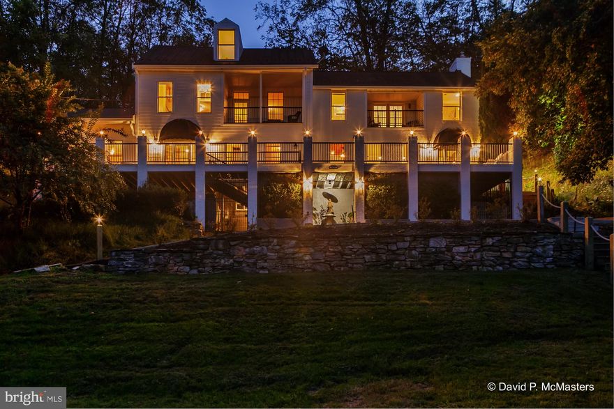 BELVEDERE ON THE POTOMAC : Potomac Waterfront  A fabulous 180 degree view of the Potomac River will greet you every time you look out the window or step on the lovely front deck of this manor type home. This is an historic site of both Revolutionary and Civil War events involving battles for the Potomac Ford, a dam, and associated mill. This home was originally associated with the mill, which no longer exists. It is considerably above the river and is very private, with only one other residence along this part of Vineyard Rd. Well out of sight down the road, the dam and it's power house remain in service. The location of the property on the Potomac near the dam protects it from an overload of boat traffic.  It is a peaceful, private, incredibly  beautiful location.  Rare indeed.   The home was clearly built (around 1790) to take advantage of the view. There is  even a peaceful OLD colonade of huge  trees at one end of the property.  The  river views across the river  both upriver and down will never change protected on  the opposite bank buffered by land that is part of the Federal C+O Canal national park.  Having worked with this property in the past we were stunned at the quality and extent of renovation the current owners have done. The new kitchen is huge and gorgeous with all new top drawer appliances. The living room has come to life. A spare room on the first floor has been transformed into an equally gorgeous  2nd kitchen/LR combo which combined with two upstairs rooms and a bath could be used as a guest suite. All the bathrooms have been very nicely re-fitted, and the 3  fireplaces are now functional and complement the interiors. A detached garage has been rehabbed into a very nice workshop or office, well insulated with, heat,  electric power to do as you will . And as part of this process, the power line  has been buried so that it no longer interferes with the river view. There is a boat ramp. The front of the property has a large lawn down to the river, the back of the home is encased  by an astounding rock formation: also beautiful  to be viewed from all the rear windows and from a patio accessed through the french doors in the dining area.  Patios, balconies  and decks provide quiet, private  and varied viewing  spots   A more complete description,  written by the seller, of the extensive renovations is within the documents section of this listing.  IN SHORT, THIS IS A GREAT LOVELY  HISTORIC 1st or 2nd home dominating a good stretch of the deep water  Potomac. "The Potomac offers beauty, recreation, and these days, comfort."  The area is home to lots of wildlife as well as wild vegetation.  Falling Waters is a convenient location for travel to  Washington DC and Baltimore Md., EZ access to I-81, close to  I-81 and I-70 Interchange near Martinsburg which has MARC commuter train to DC.    Belvedere comes   COMPLETELY FURNISHED to the nines; turn key ready to move in and enjoy.  Bring you canoes, kayaks, power boat, fishing gear and swimming suit to enjoy the Potomac .   The rarest of opportunities. .     " I go to nature to be soothed and healed, and to have my senses put in order:-Naturalist John Burroughs This property is for you if you love and enjoy the wonder of natural beauty. This property is for you if you love unique, quality construction This property is for you if you want beautiful Potomac River waterfront for recreation and enjoyment This property is for you if you like privacy. This property is for you if you want a home completely furnished ready to move in turnkey This property is for you if you want low taxes This property is for you if you want a convenient location reasonably close  to DC and Baltimore and the MARC Commuter train from Martinsburg This property is for you if you want  a place to get away that is peaceful and quiet to  let the rest of the world go by Rare opportunity.  One of a kind.