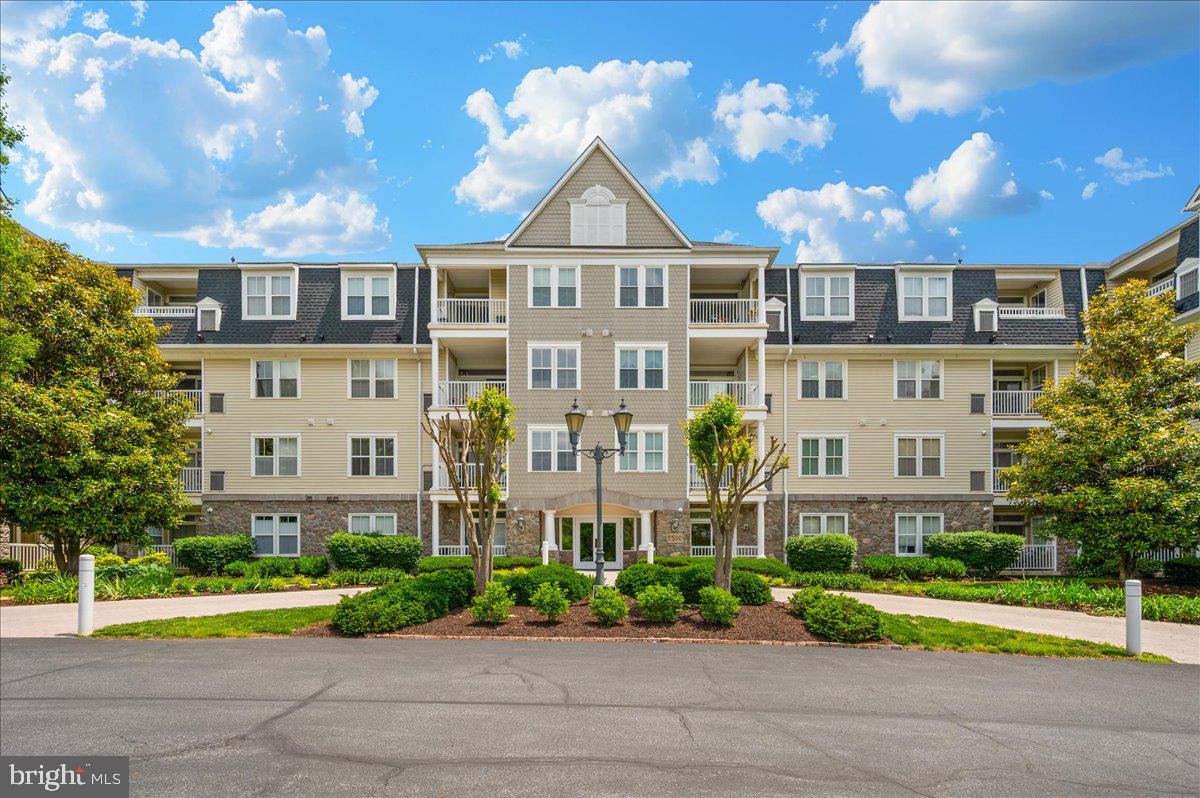 Just What You've Been Waiting For! Welcome to this beautifully appointed first-floor condominium in the highly sought-after community of Worman's Mill! Ideally situated just around the corner as you enter the secure building, this home offers easy access—no elevators or long hallways required. Step inside to fresh, modern paint tones, stylish new lighting, and an abundance of natural light throughout. The fully remodeled kitchen is a true showstopper, featuring quartz countertops, sleek new cabinetry, and stainless-steel appliances. It flows seamlessly into the dining and living areas, where you'll find elegant tray ceilings and a cozy gas fireplace—perfect for relaxing or entertaining. Step outside to your private patio and take in peaceful views of lush green space, with regular visits from local wildlife. It’s the ideal spot for morning coffee or an evening glass of wine. The spacious primary suite is a retreat in itself, complete with a stylish accent wall, two closets, and a beautifully renovated en-suite bath featuring a walk-in tile shower and double vanity. The second bedroom also boasts a chic accent wall and is conveniently located near the full guest bath for added privacy and functionality. Additional highlights include: In-unit washer and dryer, Brand new water heater, HVAC replaced in 2016, Personal front row parking place , Private storage unit. Super clean and truly move-in ready condition! Enjoy all the amenities that Worman’s Mill has to offer, from community events, pools, tennis/pickleball courts to convenient shops and delish dining—all without leaving your neighborhood. Plus, with easy access to Route 15 and major shopping and dining destinations nearby, this location can't be beat. Don’t miss out—this stunning condo is ready to welcome you home!