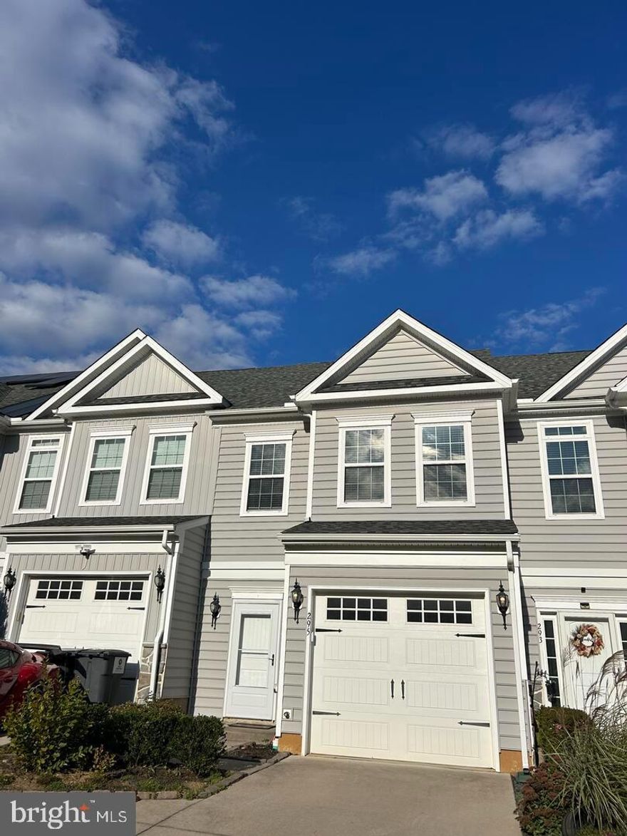 Superb townhome located in the ever popular Spring Oaks community and Appoquinimink School District!  Enter this home through the elegant foyer with wainscoating and wood floors, spacious kitchen with granite countertops, recessed lighting and stainless appliances, upgraded bathroom vanities w/granite tops and ceramic tile showers, family room w/wood floors, oversized owners suite w/sitting area, second floor laundry, garage and more!  Don't miss this gem!!