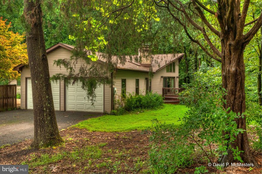 Spectacular custom contemporary,  lush 3 ac lot. Very private. Excellent cond, Basement finish-ready.  FISH POND,w/waterfall,  lovely other-worldly  setting. Great Room cathedral ceiling, wall of windows, stone W/B frpl. Luxury MBR Suite.Hardwood floors W/Radiant heat. Big deck, big patio put you in nature. 10 Min Shepherdstown, Marc Commuter Train, 5 min Potomac River.  Peaceful beautiful getaway