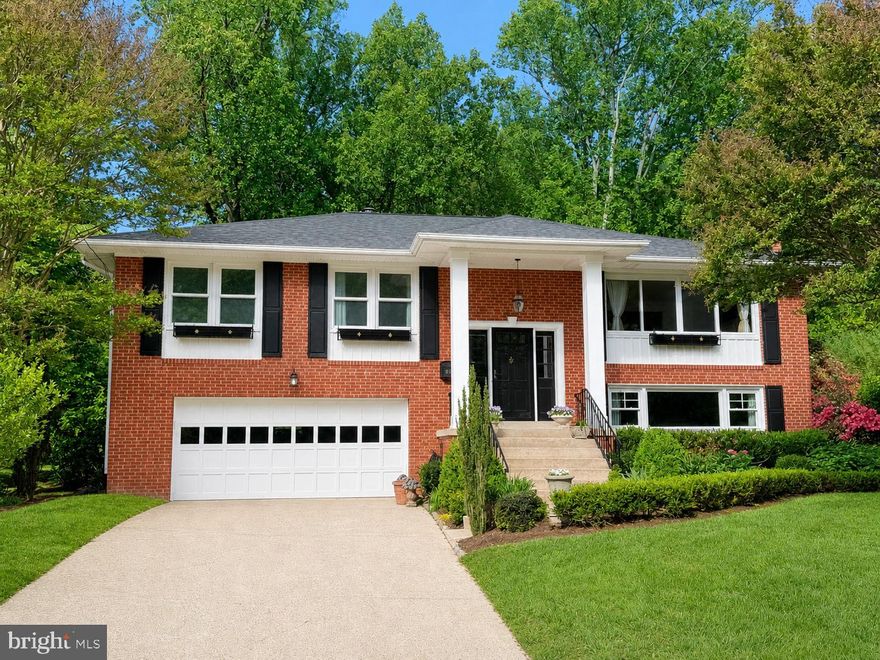 NEW ROOF JUST ADDED!!! Welcome home to this gorgeous, light-filled 4 BR/3 BA residence in sought-after Potomac Hills - ideally located between DC and Tysons Corner, nestled between Highlands Swim & Tennis Club and Linway Terrace Park.  This beautifully renovated and meticulously maintained home is placed in a serene, private setting featuring main-level-living and exceptional green space views from the backyard with nearby walking and nature trails. Step into 2500 sq. ft. of refined finished living space, with timeless original hardwood floors, a bright and open living room with gas fireplace, a formal separate dining room, and a beautifully updated kitchen featuring quartzite countertops and backsplash, along with updated appliances.  The main level also offers three comfortable bedrooms and two full baths, including a primary suite with a marble shower and a hall bath with a deep soaking tub.  The lower level features an inviting rec/family room with a second gas fireplace, an additional bedroom and full bath, plus laundry and abundant storage. Recent elegant updates – all within the last 4 years - include brand new roof in April 2026,  the gas fireplaces, kitchen counters and appliances, hall and lower-level baths, as well as a new HVAC system.  Step outside to a spacious deck and bluestone patio overlooking the level, fenced yard with borrowed vistas into adjacent Fairfax County Park land. With three distinct outdoor entertaining spaces and beautifully landscaped grounds - layered with boxwoods, hydrangeas, peonies, roses, and many perennials, the backyard is truly a private and serene retreat! Additional highlights include a 2-car attached garage offering approximately 700 sq feet, complete with a large work area and storage closet. Located in the highly regarded Chesterbrook, Longfellow, and McLean school pyramid, with one stoplight to DC!