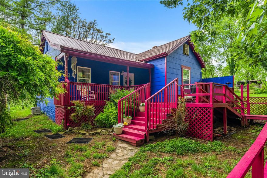 ***Professional pictures coming soon!***

Tucked away in the woods near historic Harpers Ferry and Shepherdstown, this enchanting 2BR/1BA cottage feels like something out of a storybook. Originally built in 1900, the home beautifully blends timeless character with thoughtful updates and modern comfort. Affectionately described by the owners as a “magical little fairy house,” this home has a warmth and charm that simply makes you smile the moment you walk up to it.  

The setting itself is part of what makes this home so special. Surrounded by nature, the home offers a peaceful sense of serenity that feels worlds away while still remaining conveniently accessible for commuters. The owners share that “the home just feels like light,” and that stepping outside instantly brings a sense of calm and ease.

One of their favorite spots is the spacious front porch, the perfect place to sip coffee while watching summer thunderstorms roll through the mountains or unwind in the evening while grilling and taking in the sunset. Whether you’re enjoying the quiet wooded surroundings or cozying up inside, this home invites you to slow down and savor simple moments.
Inside, you’ll find a fully equipped kitchen, cozy living spaces, and accessibility features including a ramp entrance. The fenced yard adds both privacy and practicality.

And while the home has been well loved, the important updates have already been taken care of over the years, including a metal roof, new well installed in 2008, and an updated 2-bedroom septic system completed in 2013 for added peace of mind.
Perfect for nature lovers, hiking enthusiasts, or anyone simply tired of the hustle and bustle and looking for a peaceful place to retreat at the end of the day. Whether you’re searching for a cozy full-time residence, a weekend escape near  Harpers Ferry National Historical Park, or a unique investment opportunity, this charming cottage offers the perfect blend of whimsy, comfort, nature, and convenience.