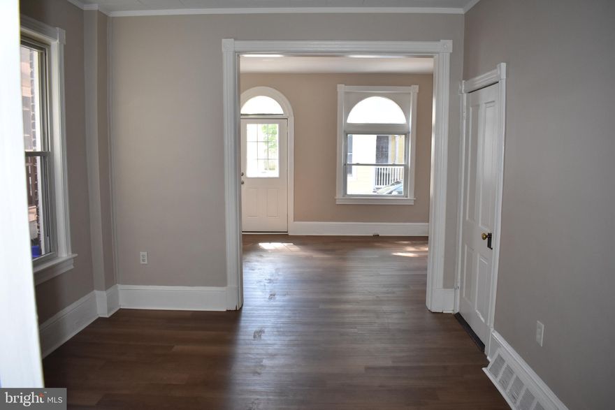 Wow!  Score an incredible bargain on this house- the price has plummeted! Don't miss out on this steal of a deal, this is a great opportunity for a first time home buyer or an investor to take advantage of a charming 3-bedroom, 1-bathroom home in the heart of historic Hagerstown!
Freshly painted with newer laminate flooring, this home also offers a fenced  and shady rear yard for hanging out on hot summer days!  On entering the home,  you walk into a bright and inviting living area, which opens into a potential dining or work space and beyond that a spacious kitchen area, boasting a tranquil view of the fenced rear yard and small paved porch.

Upstairs, there are three comfortably sized bedrooms, one of which opens to a charming Juliette Balcony overlooking the serene rear yard. The full bathroom boasts the timeless elegance of an original clawfoot tub-shower combination.