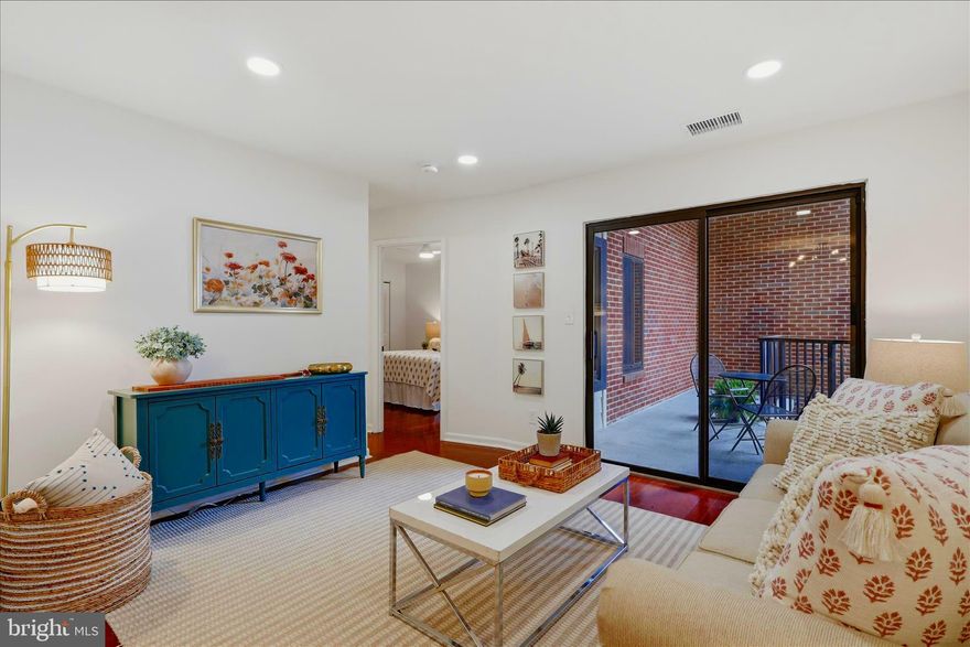 Rare opportunity to own a beautifully updated condo in a charming boutique courtyard building just one block from the Ballston Metro. Offering the perfect balance of urban convenience and residential tranquility, this light-filled 1BR/1BA residence is located in an intimate 40-unit community and includes an assigned garage parking space (#405), additional storage, and a recently remodeled parking garage.
Inside, the thoughtfully updated interior features Brazilian cherry engineered hardwood flooring, recessed lighting, and an open-concept living and dining area with sliding glass doors that lead to a private balcony overlooking the peaceful courtyard. The updated kitchen is equipped with GE stainless steel appliances, subway tile backsplash, refreshed cabinetry, updated hardware, and warm white paint throughout.

The spacious bedroom offers generous closet space, while the updated bathroom features a tub/shower combination, upgraded vanity, ceramic tile flooring, and modern lighting. Additional highlights include an in-unit stacked washer and dryer, fresh paint, recessed lighting, extra storage, and garage parking with opener.

Enjoy the convenience of Ballston living without the congestion of a high-rise, just moments from Ballston Quarter, dining, shopping, entertainment, and Metro access. A rare combination of comfort, privacy, and unbeatable walkability in one of Arlington’s most desirable locations.