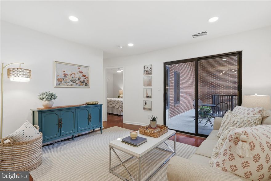 Beautifully updated 1BR/1BA condo in the heart of Ballston, just 1 block to Metro! Features Brazilian cherry engineered flooring, open living/dining area with recessed lighting, and sliding glass doors to a private balcony overlooking the courtyard. Updated kitchen with GE stainless steel appliances, subway tile backsplash, refreshed cabinets, and new hardware. Spacious bedroom with expansive closet space.. Bathroom features tub/shower combo, marble-top vanity, and upgraded lighting. Fresh paint throughout. In-unit stacked washer/dryer, extra storage, and assigned garage parking space (#405) with opener. Unbeatable location just 3 blocks to Ballston Quarter dining, shopping, and nightlife!