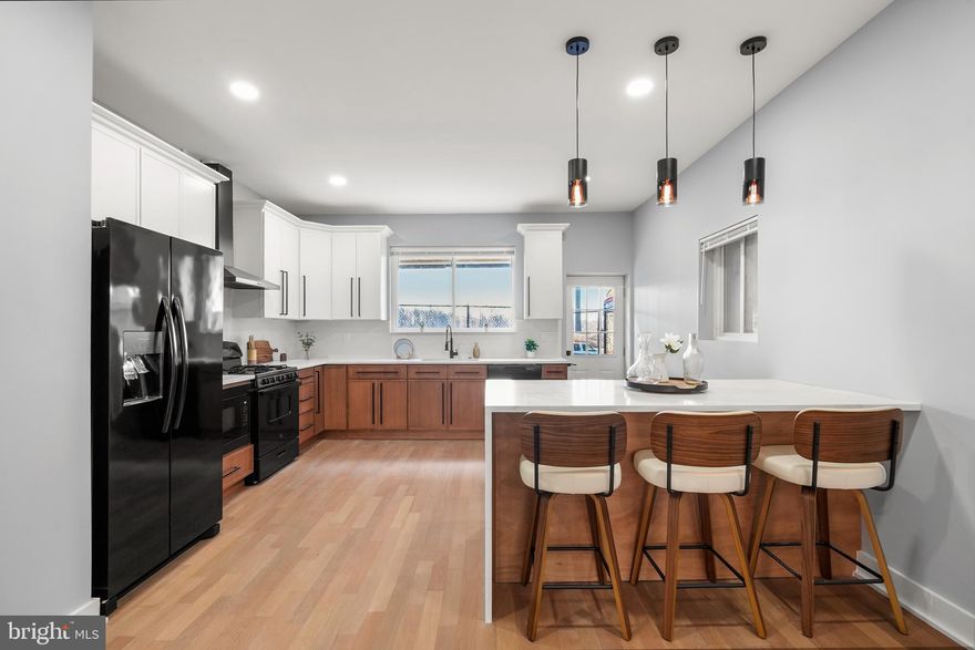 Stunning Fully Renovated Port Richmond Rowhome with Finished Basement & Designer Kitchen.
Welcome to 2811 Salmon Street, a beautifully renovated 3-bedroom, 2.5-bath rowhome located in one of Philadelphia’s fastest-growing neighborhoods. This thoughtfully updated home features wide-plank hardwood floors, high ceilings, and an open-concept main level that seamlessly connects the living room, dining area, and designer kitchen. The stunning kitchen includes a center island, quartz countertops, sleek two-tone cabinetry, modern fixtures, and a gas range with hood. A convenient half bath is located just off the dining area.  Upstairs, the spacious primary suite offers dual closets and a spa-inspired en suite with dual rain showers and a glass enclosure. Two additional bedrooms and a stylish hall bath with modern tilework and vanity provide plenty of space for family, guests, or a home office. The fully finished basement adds valuable living space, perfect for a family room, home gym, office, or entertainment area, with laundry hookups and utility access already in place. Enjoy new concrete and a charming front garden, plus a private rear yard with breezeway access to nearby public parking. Conveniently located just 5 minutes from Fishtown and 8 minutes from Center City Philadelphia, offering easy access to dining, entertainment, and city amenities.