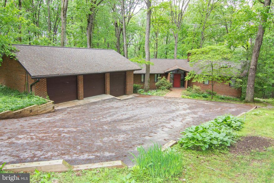 Welcome home to this custom built brick rancher with lots to offer.  Surrounded by almost 4 acres of beautiful nature. This 3 BR, 2 FB, 3 car garage w/ a pit, updated kitchen, 2 fireplaces, central vacuum, lg. deck, breezeway. is a Nature's Paradise.