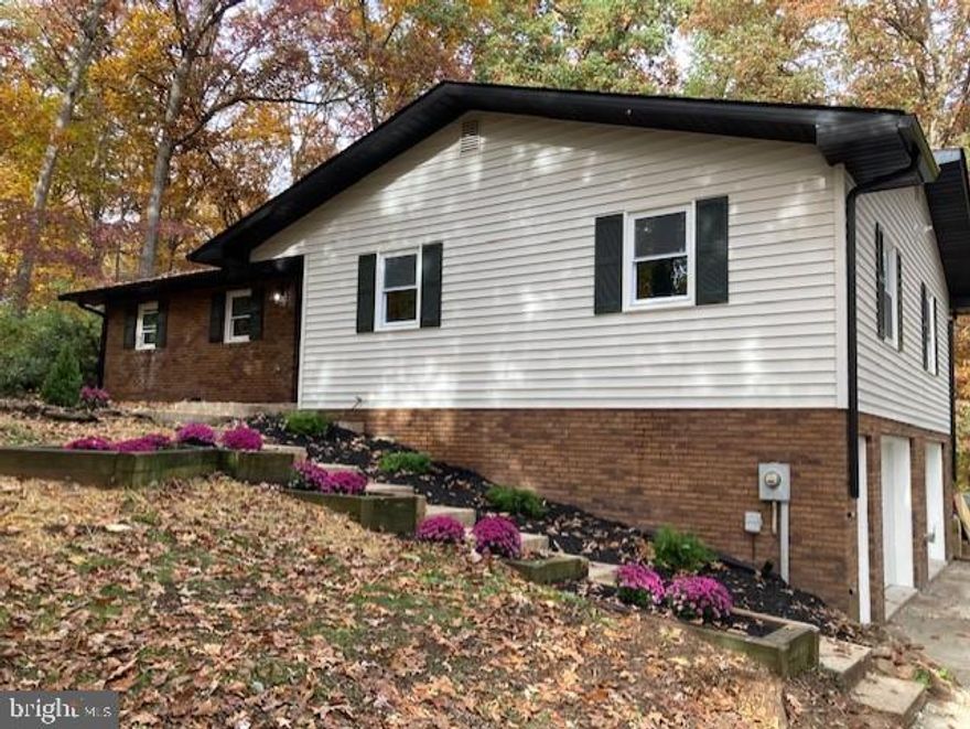 Updated house is almost ready for new owners. Very nice, private location. Many updates including new driveway, new doors, new windows, new flooring. Beautiful kitchen with white cabinets and quartz countertop. Huge deck for family entertainment.