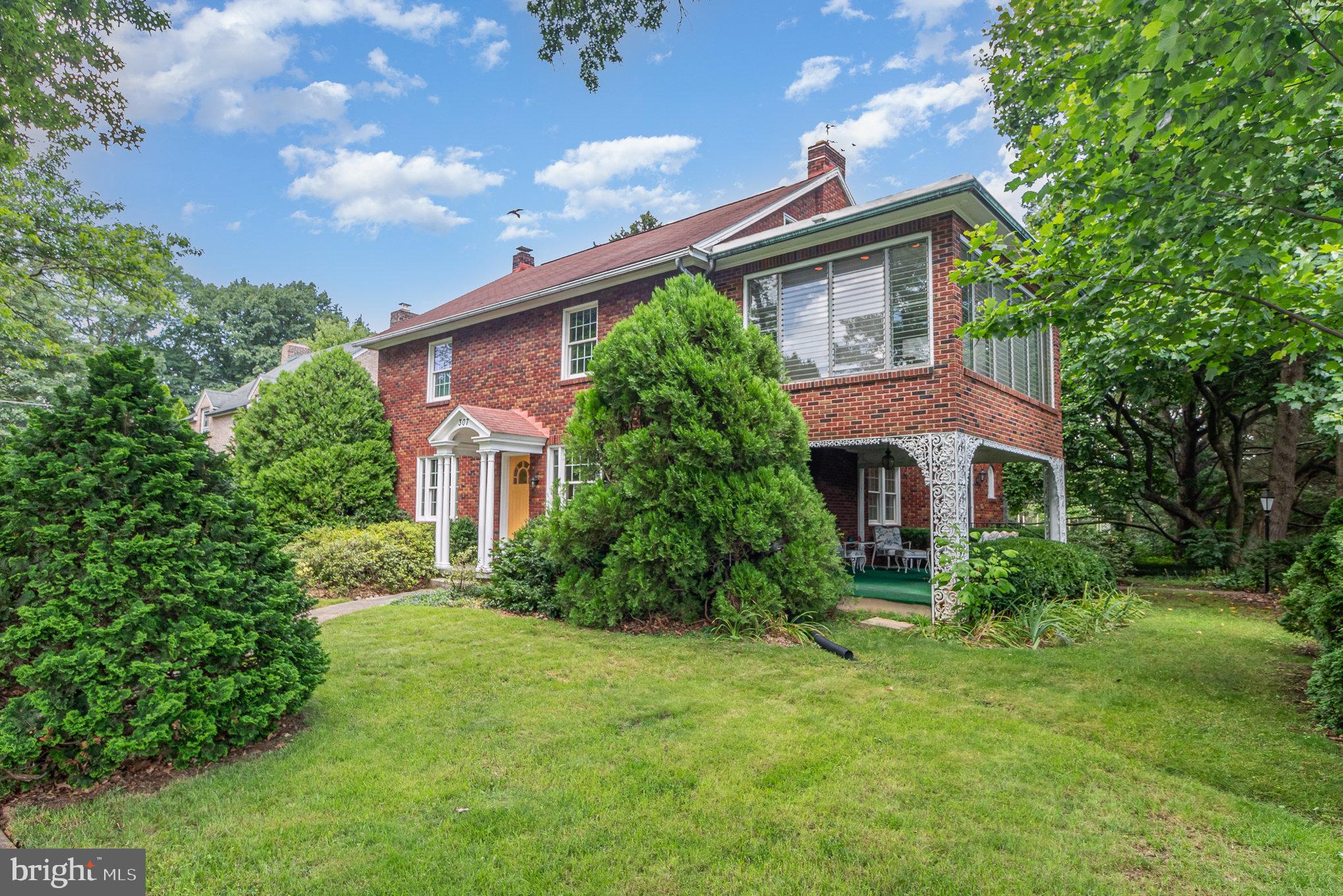 Truly a RARE find in Camp Hill Borough! This one-of-a-kind, 2 story brick home on over 1/2 acre offers 5-6 bedrooms, 4 full baths, main level in-law/auPair Suite, elevator and 2 detached garages offering space for 5 vehicles! Situated catty-corner from Hoover Elementary School, this beautiful home is a short, three block walk to Camp Hill Middle School / High School, Fiala Field and numerous amenities on Market Street. The expansive living and dining rooms have hardwood floors and lofty 8'4" ceilings. The living room features a gas fireplace, stunning spiral staircase and custom slate foyer and hearth. The kitchen offers basketweave marble flooring, soapstone counters, travertine backsplash, coffered ceiling, custom cabinetry and a 6 burner, vented gas stovetop. The main bath has ceramic tile flooring and beautiful Carrera glass walls. The in-law/auPair Suite has a full bath, bonus room and private rear entrance and is awaiting your final cosmetic touches. The mudroom off the back porch has slate floors, lockers salvaged from Camp Hill High School, laundry sink and cedar closet. The second level has 4 additional bedrooms, including a primary bedroom with hardwood floors, ceiling fan and full bath with ceramic tile floors and vintage Carrera glass walls. The 2nd level sunroom has built in shelves and a gas fireplace with sandstone surround. The second level family and bonus rooms at the rear of the home offer stunning views of the backyard and have access to the elevator and rear stairwell. The finished attic space is heated and cooled providing additional living space. The spacious basement has interior and exterior access and includes a large storage area, workshop and large laundry room with a laundry chute that services both first and second floors. Exterior features include 2 covered porches, large private yard, 4 car garage and pole barn with space for a 5th vehicle.