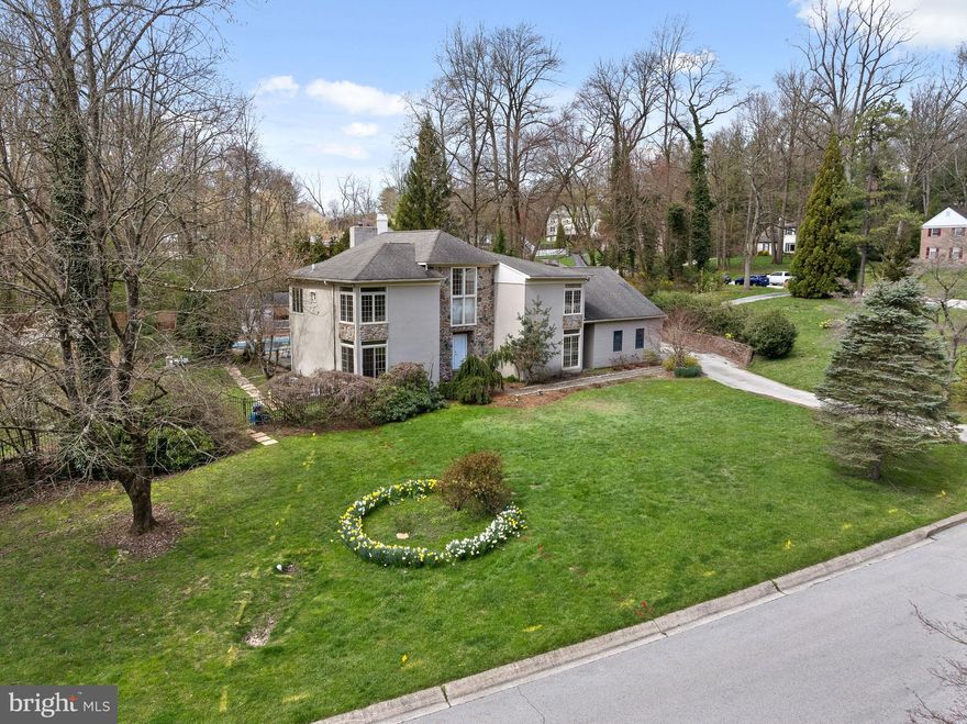 This home is nestled on quiet, tree lined, coveted Hermitage Drive, in the heart of Radnor township close to Downtown Wayne, restaurants, shopping, and train.  This 5 bedroom, 5.5 bath home set on 1.3 acres features a contemporary aesthetic while being comfortable and functional inside, and is awaiting your finishing touches to make it your dream home! A large Pool, Pool house and flagstone patio accentuate the expansive backyard and make this home your own personal retreat. 
As you step inside, you're greeted by natural light cascading through the many windows and hardwood floors throughout, inviting you to explore this fabulous residence.  The two story foyer with closets flanking the front door, is open to a formal living room, perfect for entertaining. 
The spacious family room provides the perfect setting for intimate gatherings or cozy nights by the fireplace accented with floor to ceiling marble surrpound, while the dining area offers an elegant space for hosting memorable dinners with loved ones. A private office makes working from home a treat with views of the grounds and a sliding door opening to a private patio.  
The kitchen is spacious, boasting granite countertops, stainless appliances, and plenty of storage space for all your culinary essentials. With a center island, breakfast room area with table space and glass sliders to the oversized patio and pool beyond it is truly the heart of the home. A laundry room conveniently located near the garage entrance and a powder room complete the main floor.
Retreat to the oversized master suite complete with ample closet space and an en-suite bathroom featuring a stall shower, double vanity, and soaking tub the perfect place to unwind after a long day.
Three additional spacious bedrooms that ensure there's room for everyone to feel right at home, all featuring double closets. Bedroom four is an en-suite with a recently renovated (2016) bath featuring a tiled surround walk-in shower with frameless glass doors and a granite topped vanity.  The shared Hall bathroom has also been renovated (2016) and features a double sink vanity, marble tiled shower and marble floor with ample storage.   
With a separate entrance the fifth bedroom en-suite is located above the garage, the bath is neutral and has a walk-in shower. This space has its own thermostat and heating system. 
Step outside into your private back yard where a sparkling pool beckons on warm summer days and a charming pool house provides the perfect spot for relaxation, respite from the sun, or entertaining guests. Surrounded by lush landscaping and mature trees, this outdoor oasis offers the ultimate in privacy and serenity.
The lower level (not included in Sq Footage) is a walkout with a bar area, custom sauna and full bath, and has recently been waterproofed, leaving the space to be refinished and expanded upon by the new owners. 
With a coveted location in Radnor Township, this home offers the best of both worlds – a peaceful retreat just minutes from all the conveniences of Wayne, King of Prussia and Philadelphia.  Shops, restaurants, parks, and top-rated schools are all within easy reach, making this the perfect place to call home.  
Schedule your showing today and make this unique residence yours before it's too late.