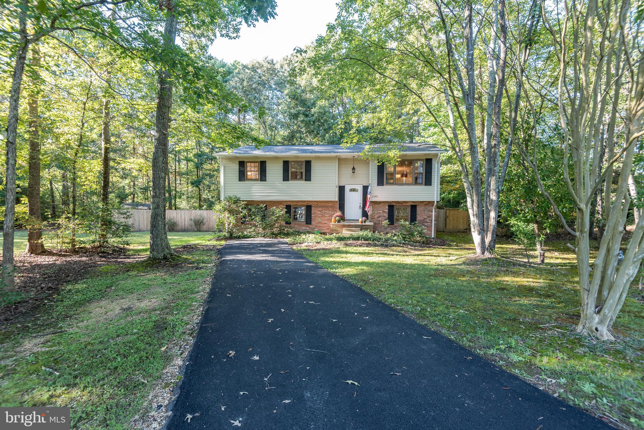 Welcome home to rural and convenient Magnolia Drive! This home has been loved well and in the last few years has had a beautiful kitchen renovation in tasteful and timeless choices to include cabinets, counters, backsplash, and appliances; a complete hallway full bath renovation, and the primary bath was refreshed last year also (everything but the shower!). You'll love the new lighting and maintenance-free flooring throughout the upstairs level, that pair so well with the kitchen and bath spaces. And with all that has been done inside, you'll have plenty of time this season to enjoy the new deck and the new privacy fence. When winter knocks on your door and says its time to turn on the heat, you'll appreciate the new HVAC system. Situated beautifully on its lot, the yard is full of blooming perennial shrubs that merely need a trim once per year and contribute to the fabulous curb appeal, beyond the new asphalt driveway completed last month. If it's important to you to have a quiet rural setting and reach Routes 4, 5 and 235 quickly, make Magnolia yours!
