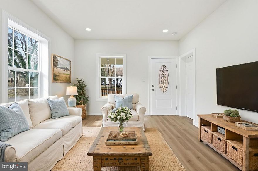 Welcome to your fully renovated, move-in ready home in the growing town of Remington. With over 2,000 square feet of finished space on two levels, this 4-bedroom, 3-bath single-family home sits on a total of .92 acres—two separate tax parcels, including a buildable .34-acre lot offering future investment or expansion opportunities.

The full-length front porch immediately sets the tone, creating an inviting outdoor living area perfect for morning coffee or evening relaxation. Step inside to an open and bright main level featuring luxury vinyl plank flooring, upgraded trim, and a brand-new kitchen with an 8-ft island, stainless steel appliances, and abundant natural light from oversized windows throughout.

The main level offers true one-level living with two bedrooms, including a spacious primary suite at the rear of the home complete with a private bath, walk-in shower, and oversized walk-in closet. A second bedroom—or ideal home office—sits at the front of the home with generous closet space and beautiful natural light. A separate laundry room and an additional full bathroom complete the main level.

Upstairs includes two additional bedrooms, a second living room or flex space, large closets, and another full bathroom—ideal for guests, roommates, multigenerational living, or creating a private retreat away from the main level.

No HOA. High-speed access options available. Located minutes from the Rappahannock River with public access at the Rector Tract launch site for kayaking, canoeing, and outdoor exploration. Remington is a high-growth corridor with quick access to Route 29, commuting routes to Warrenton, Culpeper, Bristow, Gainesville, and easy connection to Fairfax—without relying on country backroads.

A rare combination of modern renovation, flexible floor plan, investment opportunity, and small-town convenience. This one checks every box.