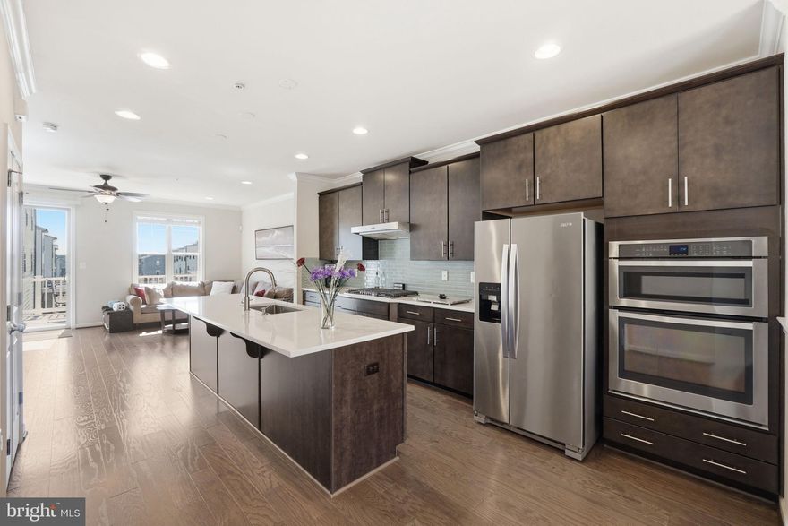 Welcome to this beautifully appointed three-level townhome in the highly sought-after Cabin Branch communit. Built in 2017, this spacious residence offers the perfect blend of comfort, style, and convenience. Featuring three bedrooms, three full baths, and one half bath, the home is thoughtfully designed with both everyday living and entertaining in mind. The sun-filled interior showcases an open layout with abundant natural light throughout, creating a warm and inviting atmosphere on every level. At the heart of the home, the gourmet kitchen is sure to impress—complete with high-end finishes, ample cabinetry, and generous prep space, seamlessly flowing into the main living and dining areas. Retreat upstairs to well-proportioned bedrooms, including a comfortable primary suite, while the additional levels provide flexible space for guests, a home office, or recreation. Ideally located with easy access to shopping, dining, and major commuter routes, this home offers the best of convenience and community living in one of Montgomery County’s most desirable neighborhoods.