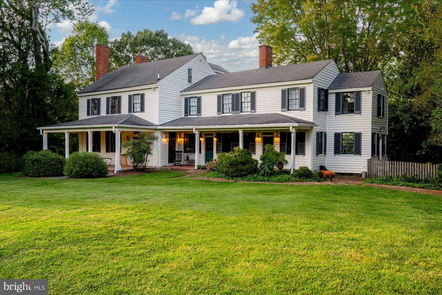 Historic Portland Manor – Allendale is privately set on 4.5 acres off sought-after Brooks Woods Road, surrounded by mature trees, neighboring acreage, and pastoral surroundings. A heritage tree-lined drive leads to the residence, framed by established landscaping, gorgeous brick walkways surrounding the home, landscape lighting, covered porches, and a renovated in-ground pool.  Dating back to the late 1700s, with additions completed in the early 1800s, the home has been thoughtfully restored and updated while preserving its historic integrity and original craftsmanship.  Offering an estimated 5,100 square feet, the property includes six bedrooms and four and a half baths across the main residence and separate in-law suite. Interior features include original heart pine flooring, restored historic windows, six fireplaces, a traditional central hall layout, three staircases, multiple gathering spaces, and extensive custom built-ins and storage throughout.  The main level includes a formal dining room with marble fireplace and adjoining butler’s pantry, family room with restored marble fireplace, living room with fireplace and custom built-ins, greenhouse room, powder room, and multiple access points to the home’s covered porches and outdoor living spaces. The custom kitchen features extensive handmade cabinetry and tile work, custom shelving and pantry storage, soapstone and butcher block countertops, commercial-grade gas cooking with a double gas range, vent hood, griddle, separate service sink, and generous preparation space designed for entertaining and everyday functionality. A storage closet beneath the main staircase and extensive built-in cabinetry throughout the connecting gallery to the in-law suite provide exceptional functional storage rarely found in historic homes.
The second level includes the primary suite with a large walk-in closet, private kitchenette, fireplace, and ensuite bath. Two additional bedrooms are located on this level, each featuring fireplaces, with one offering an ensuite bathroom.  The third floor offers two additional bedrooms, a full bathroom, a large finished storage closet, and expansive attic storage space.  The separate in-law suite, originally constructed in 1785, includes a living and dining area, kitchenette, full bathroom with private laundry, and an upper-level bedroom with vaulted A-frame ceiling.  The residence includes eight exterior doors leading to approximately 1,000 square feet of covered brick porches, landscaped walkways, pool areas, and outdoor gathering spaces, creating a seamless connection between the home and grounds.  Outdoor features include a fully renovated 20’ x 40’ pool (2025), pool house, custom fire pit patio with built-in seating, large deck with new decking (2025), fenced areas, extensive landscape lighting, and a custom Williamsburg-style chicken coop.  Major system updates include two high-efficiency HVAC systems, updated plumbing and electrical systems, and new 400-amp electric service (2025). The exterior was fully repainted in 2026.  A rare offering combining historic character, extensive restoration, privacy, acreage, and modern livability, conveniently located near The Cannon Club, local farmers markets, waterfront dining, and commuter routes.  Open House by appointment only. Two Tax IDs convey.