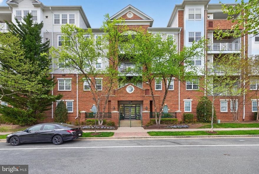 Significant Price Reduction!  Don't miss this opportunity to move in this fabulous condo with an unbeatable location.  Unit 203 offers 1725 s.f. in sought-after 327 King Farm Blvd features an Open Floor Plan, with 2 large primary bedrooms, 2 well appointed bathrooms, a large Den/home office, 2 assigned Parking Spaces and a balcony. This condo boasts easy living all on one floor with a spacious, flexible Floor Plan; expansive living space w/ recessed lighting, high ceilings and beautiful crown molding with access to the balcony. The spacious eat-in kitchen has 42 inch natural cherry cabinets, granite countertops and Kitchen Aid appliances.  Two inviting bedrooms feature expansive walk-in closets. The primary bathroom has a separate shower and large soaking tub and a second bathroom has a tub/shower combination.  A real bonus in this unit is the separate home office/den w/ a third large walk-in closet.  A convenient in-unit laundry room has a full sized washer and dryer.  Unit 203 offers plenty of parking with one reserved indoor garage space #37, and one additional reserved outdoor space #2. Located in a prime location, directly across from the King Farm Village Center, relax in the Village Green or enjoy the convenience of shopping and a  myriad of restaurants to choose from.  Easy access to public transportation with the convenient free shuttle to the Shady Grove Redline Metro.  Enjoy walking trails, tot-lots, pickleball and get ready for summer fun at the community pools..and you can see the July 4th Fireworks from the balcony! Well maintained and lovingly cared for #203 is the perfect blend of modern living and timeless elegance in an exceptional residence. Pets welcome with some restrictions.