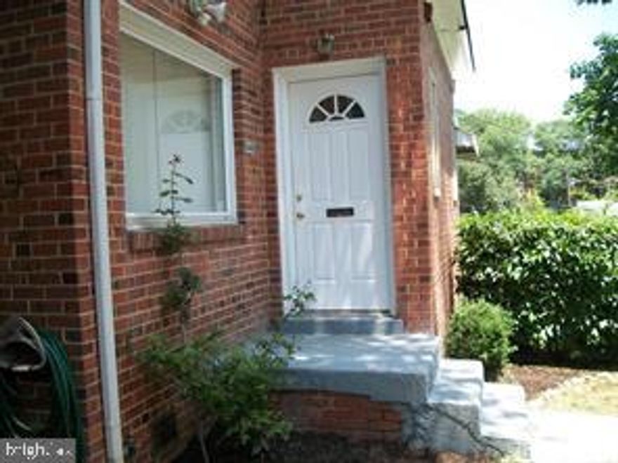 Beautiful Semi- Detached End Unit  Row-House. This home has Hardwood Floors, Granite Counter Tops, 2 full baths, private backyard with fence. This is a must see.