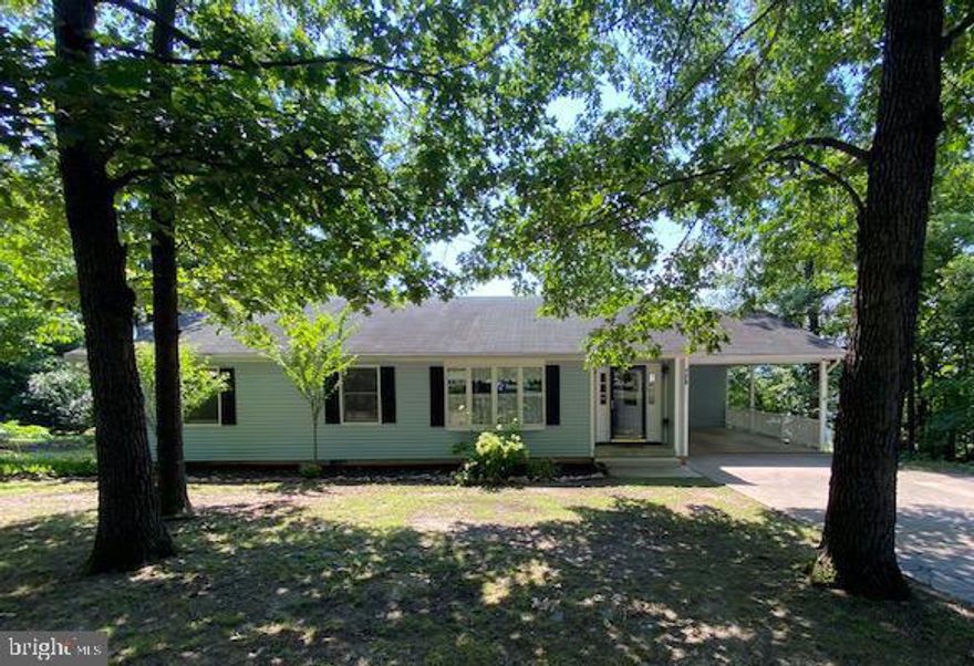 Come see this very cute home with 3 bedrooms, 2 full baths, living room, family room, dining area and very efficient kitchen all on one level.  There is a large rear deck with mountain views, a large carport and generous storage room all on a partially wooded lot with mature trees for shade.