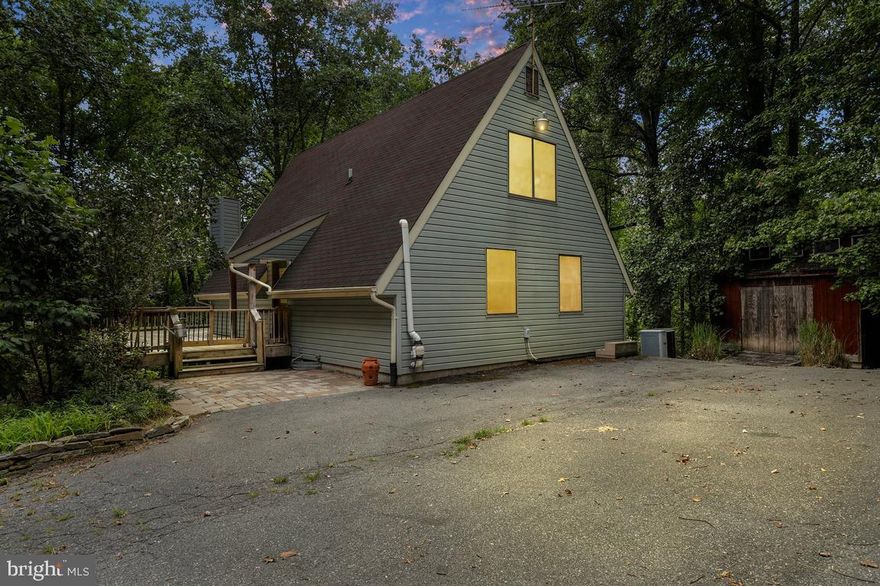 Rare opportunity to own nearly 4 Acres of amenity rich property paired with a striking home in beautiful Carroll County! This home features 3 Bedrooms 2.5 Bathrooms and a finished basement featuring a room perfect for a den, office or extra sleeping space.  Get cozy under the two story ceilings while you soak up the natural sunlight shining through the pair of large picture windows.  Grab your drink of choice and step out of the living room onto the massive wraparound deck and enjoy the views. From the open yard ready for your garden or animals, to views through the woods of Little Morgan Run, the views throughout the changing seasons will have you falling in love more each day.

Nestle that project car you're going to finish this year for the fifth year in a row in the 25' x 40' detached garage with automatic door, air conditioning and built-in air lines. This space could be used for a multitude of uses including storage space.

Move in just in time to throw that house warming party and enjoy the personal swimming hole that connects to the stream running through the bottom of the property before the weather breaks!

Improvements in recent years include new well pump, carpet/flooring, washing machine , water heater and recently serviced A/C