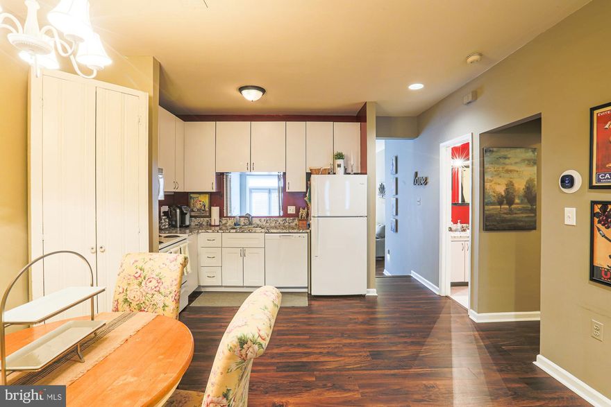 RARELY available, and beautifully updated, pet friendly, garden level unit with large, fenced patio!! Sunken great room with HIGH ceilings and sliding glass doors leading to private fenced brick patio. Washer and dryer included. Brand New Updates Through-out Making this a charming and unique opportunity. COVERED deeded parking space just feet from the front door. GREAT location and so convenient to EVERYTHING! WON'T LAST LONG!!