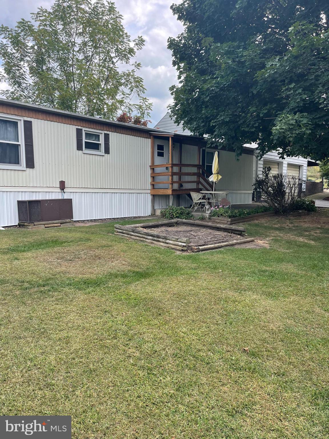 Discover this 2-bedroom, 2-bath mobile home situated on 2.99 acres in a peaceful, private setting. Inside, you’ll find a comfortable living room, a nice kitchen, and a convenient laundry area with washer and dryer included. Central air ensures year-round comfort. Step outside to enjoy a spacious yard surrounded by nature—perfect for relaxing, gardening, or outdoor activities. All this, just a short drive to shopping, dining, and city conveniences. Don't miss this one give me a call today!