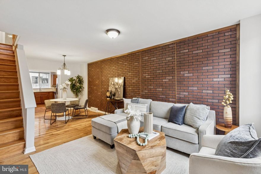 627 Fernon Street (19148) is the kind of South Philly home that buyers move fast on: clean, bright, and immediately livable, with the right mix of character and updates.

Step inside to warm hardwood floors and a welcoming living room anchored by a feature wall that is a perfect backdrop for cozy nights, a gallery wall, or your TV setup. The layout flows naturally into a dining area that actually fits a real table (not just “bistro seating”), then continues to an updated kitchen with granite counters, stainless steel appliances, a gas range, and recessed lighting—ready for weeknight cooking or hosting friends.

Upstairs, you’ll find two comfortable bedrooms with great natural light and a fresh, neutral full bath with a clean tiled surround. Downstairs, the full basement with dedicated laundry + tons of storage (and room for a gym corner, bikes, or seasonal bins). Out back, enjoy a private patio—ideal for grilling, container gardening, or a quiet coffee break.

If you want a move-in-ready 19148 home with charm, space, and practical upgrades — this is it.