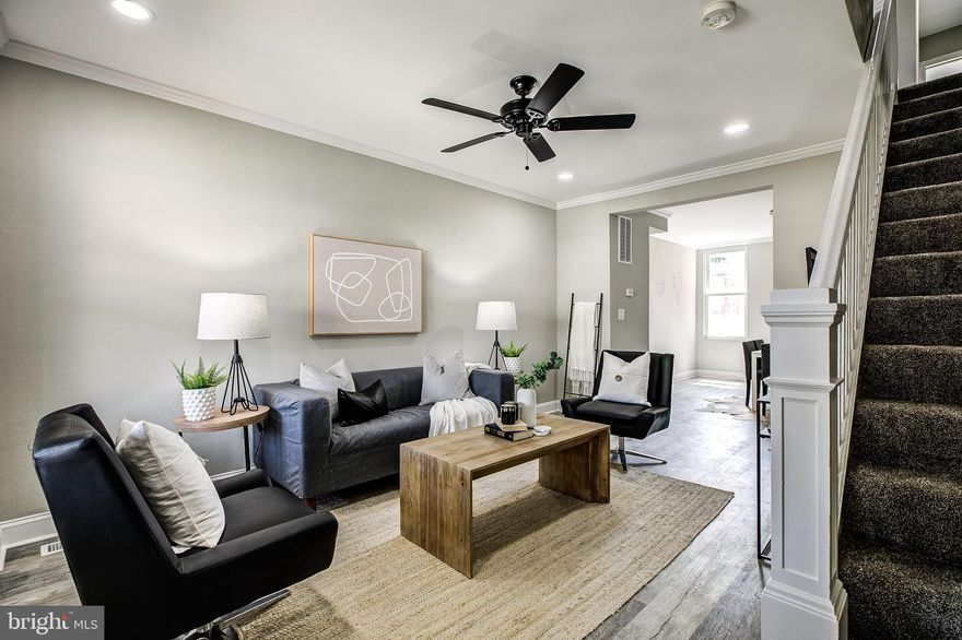 Gorgeous full renovation in a cheerful block in Edmonson Village. This 3BR/2BA + basement family room is a classic beauty. Enter the brick home to an expansive living room with ceiling fan, crown molding, and recessed lighting. Notice the original stair railing and newel post that have been meticulously restored. The open floor plan living room leads to a spacious dining area with central light fixture and to the brand new kitchen. The kitchen contains all new cabinetry, full SS appliance package, quartz tops, and offers a walkout to the rear deck and parking. Meander upstairs to find 3 spacious bedrooms and a new custom-tiled full bath with skylight. The newly finished basement includes recessed lighting, plush carpet, and a second full bathroom. The rear of the basement offers a useful utility area for storage and laundry. This home offers a lovely covered front porch for enjoying warm spring days. Beyond all the amazing cosmetic upgrades, his home has all new windows, roof, all mechanicals (plumbing, electric, HVAC) and is ready for you to move right in! *Buyer's Financing Fell Thru - Back on Market!*