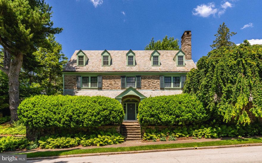 Welcome to 3 Norman Lane, a gracious home in the heart of Chestnut Hill. This distinguished residence circa 1904, designed by noted Philadelphia architect Robert McGoodwin exudes timeless elegance and offers luxe living in a prime top of the Hill location. Step inside and be greeted by the grandeur of the center hall colonial layout with arched doorway, statement staircase, and noted artist, Anya Larkin wallpaper. The main floor includes a generous living room, dining room, butler's pantry, and contemporary Bultaup kitchen. Ideal for entertaining, the floorplan flows seamlessly from room to room, with generous space for gatherings both large and intimate. On the main floor, there are three bonus rooms including the sun porch, study with built in bookshelves, and mudroom. Back stairs to the second floor have unique wall coverings made of recycled tires from Germany! The second floor hosts the main bedroom suite, complete with full bathroom and professionally designed closet. Additionally, the second floor offers three more bedrooms, two full bathrooms, and laundry. The third floor includes two full bedrooms, bathroom, full attic and cedar closet. With elevated surprises like radiant floor heat in the kitchen and main bathroom, Mercer tiles in the mudroom, four fireplaces, high hat lighting in every room, and 13 professionally organized closets--the attention to detail is evident. An abundance of light throughout the home cannot be ignored! Outside, a professionally designed garden by local favorite landscape architect Fred Peck delights, offering a serene retreat amidst lush greenery in a very private setting. This garden won best of the Philadelphia Flower Show years ago. The location is ideal as it is walkable to all the shops, restaurants, and amenities Chestnut Hill has to offer, while just a block from the Wissahickon Park and beloved Crefeld trailhead. Not to be missed, let us bring you home to 3 Norman Lane!
