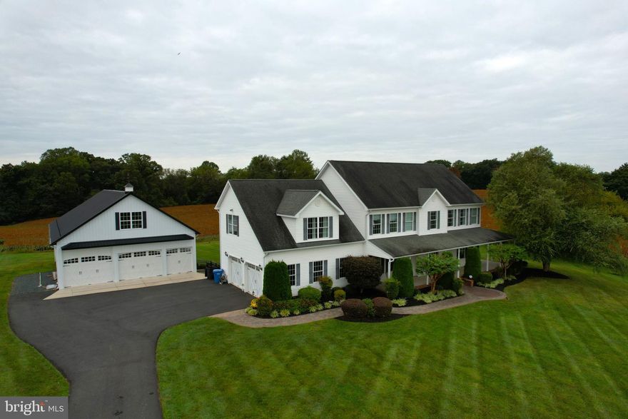 5 bedrooms, 3 full baths and 2 half baths. 4 HVAC systems. Oversized and high ceilings through out. 3852 sq ft of finished living space. Eat in country kitchen with huge island, corian counters, pantry. Family room with gas fireplace. Formal living room and dining room. 33x28 attached garage with separate entrance to  Au Pair suite with full bath and separate hvac. Primary suite has sitting area, 2 walk in closets, jetted tub, separate shower, double vanity. Bedroom level laundry. Pull down attic steps. 60 x 36 outbuilding with separate hvac  and upper level loft. Workshop is 60x16. Built in shelves, cabinets and carlift. Wrap around porch and deck. Firepit.Quick connect for gas grill, grill is included. Fenced rear yard. Crop fields and Woods. Room to expand the living area. Call lister for details. Showings are by appointment only