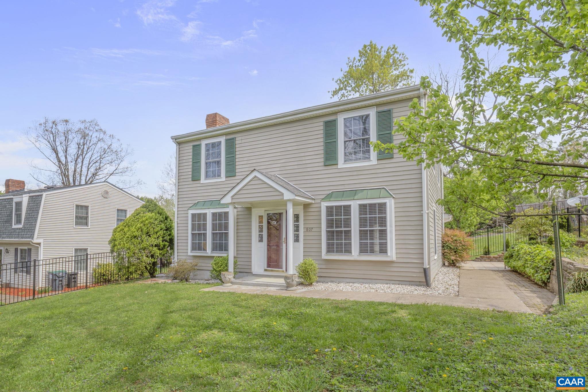 Five Minutes to Downtown + Fenced yard. Just five minutes from the Downtown Mall, this well-maintained 3-bedroom, 2.5 bath home offers a rare combination of location, space, and outdoor living. The large kitchen flows into a light filled dining room and there is a separate living room with a fireplace - ideal for both quiet nights in and easy entertaining. Wood floors, abundant natural light, and a smart layout make the enterior feel warm and open. Outside, enjoy a fenced yard perfect for pets, play, or gardening, plus a separate storage room for all your extras. A solid find in one of Charlottesville's most convenient spots.,Formica Counter,Wood Cabinets,Fireplace in Living Room