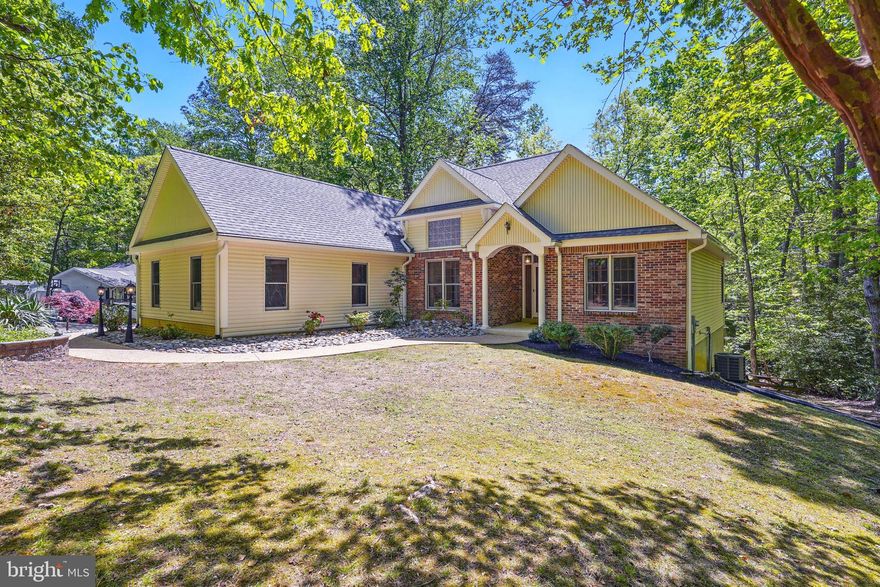** OFFER DEADLINE - 5/5 AT NOON** 
Welcome to 12543 Calyx Rd, a beautifully crafted custom rambler tucked away on a private lot in the sought-after Chesapeake Ranch Estates community. This bright and airy home boasts hardwood floors throughout, vaulted ceilings that enhance the open feel, and a cozy gas fireplace perfect for cooler evenings. The thoughtfully designed layout includes a spacious two-car garage, elegant paver walkways, and a large deck ideal for outdoor entertaining or simply relaxing with nature. The partially finished walkout basement offers additional living space and endless possibilities for customization.
Living in Chesapeake Ranch Estates is about more than just a beautiful home—it's a lifestyle. Enjoy exclusive access to bay and lake beaches, a community playground, and even a private airstrip. Plus, you're just minutes from the vibrant waterfront town of Solomons Island, where marinas, restaurants, and seasonal events await. With convenient access to Patuxent River Naval Air Station and all the shopping and dining in nearby St. Mary’s County, this home perfectly balances privacy, community, and everyday convenience.
This home also shines when it comes to maintenance and upgrades: Similar-style Gutter Helmets were installed in 2023 and come with a lifetime warranty, the roof is only four years old (2021), and the HVAC system—including both heat and A/C—was installed in 2022. The hot water heater is also new, and the windows fold in for easy cleaning. Bonus: the master bedroom furniture (except the long dresser) can stay—move-in-ready has never looked better.
Don't miss the opportunity to make this charming retreat your own!