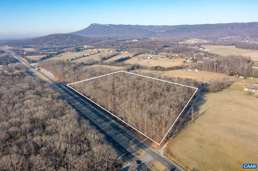 Idyllic setting on 9.640+/- acres along Route 33, located under 3 miles from Massanutten Resort and around 3.5 miles to the Town of Elkton.  Enjoy views of the Blue Ridge Mountains and the convenience of nearby shopping.  Parcel is wooded and zoned A-2, with 950+/- feet of road frontage.  The timber on the parcel was valued at $20,000 gross and conveys with the land.  More information can be provided upon request for serious purchasers.  VDOT has approved a driveway entrance onto the property, see available plat for location and other details.  Boundary lines on accompanying pictures are approximate, see plat for details.