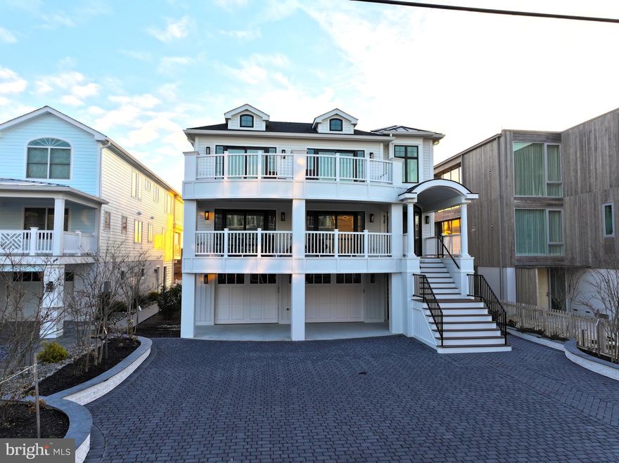 Custom built 5 Br. 5 Ba. home (completed 2022) on the direct ocean front in beautiful Fenwick Island.  Extra-large front parking (pavers) plus a three-car garage.  Enter the home in to the two story foyer with a custom "bubble" chandelier hanging above.  This level has 2 guest bedrooms,  plus the primary bedroom which is on the ocean front of the home. A large open deck off the front and back of this level.  The large laundry room is also on this level with plenty of storage and a set of Electrulux front loading washer and dryer.  A separate sitting room with a gas fireplace is on this level. Walk up the curved staircase with a custom-made wrought iron railing (with accent lights by the treads) to the main living area. As you look down the wide hall your first view will be of the ocean and beach.  Two additional bedrooms are on this upper level each with their own baths.  A beautiful kitchen with a pantry has excellent exposure to your guests as well as the views of the beach and ocean.  This home has been used as a second home by the current owners after construction was completed in 2022. Upgrades are everywhere, too many to list  here but your clients will surely see the quality of care given to the construction and layout of this fine home.