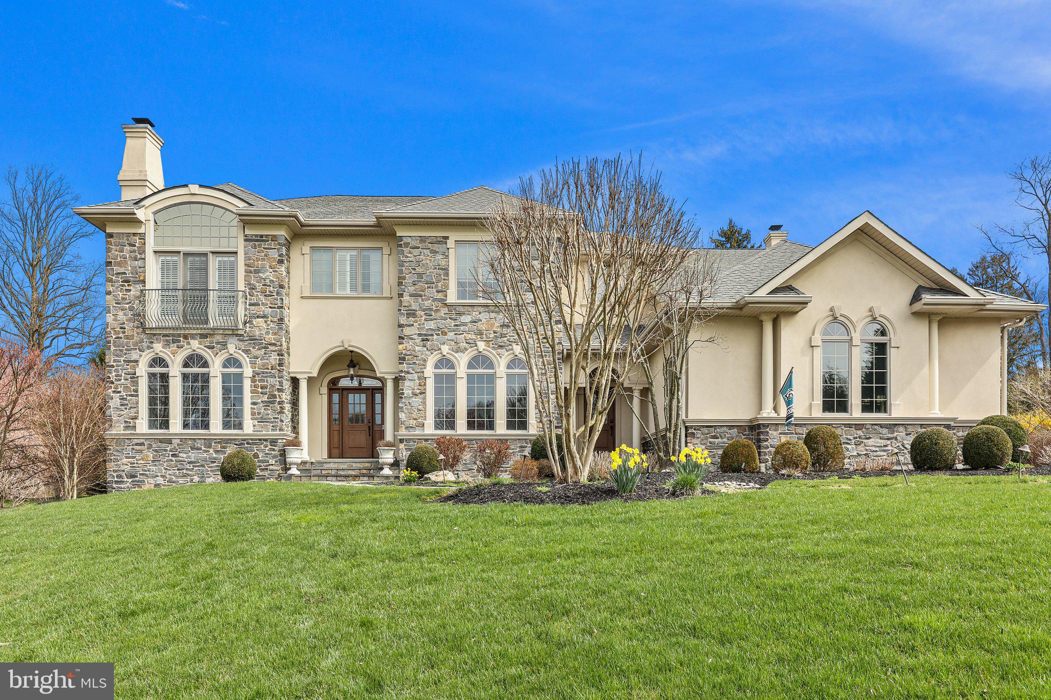 Welcome to the epitome of luxury living in Lower Moreland's finest neighborhood. This custom-built Villa, boasting 4 bedrooms, 4.5 baths, and a generous 3-car garage, is a masterpiece of design and craftsmanship. Enter through the dramatic foyer adorned with exquisite Brazilian Cherry hardwood floors, setting the tone for the elegance within. The open-concept kitchen, with its soaring 10 ft ceilings, is a chef's delight, featuring custom-built wall units, top-of-the-line appliances, and stunning granite and wood counters. Entertain effortlessly in the unbelievable family room, boasting 12 ft ceilings and a custom fireplace surrounded by intricate trim work. Enjoy natural light streaming into the breakfast room, leading to the covered California room with a cozy fireplace and bluestone patio - perfect for outdoor relaxation, complete with a hot tub and electronic retractable cabana. Upstairs, the primary suite is a sanctuary with vaulted ceilings, a relaxing sitting room, and dual walk-in closets. The luxurious primary bath features an oversized shower, jacuzzi, and dual vanities. Three additional spacious bedrooms, including a princess suite, provide ample accommodation. The second floor also features a convenient laundry room for added convenience. Descend to the spectacular finished walkout basement, offering multiple retreat areas, including a full granite bar, wine room, HD golf simulator, and fitness room - the ultimate recreational space for family and friends. This home is truly spectacular and must be seen in person to fully appreciate its beauty and grandeur. Don't miss the opportunity to make this your dream home. Schedule your viewing today!