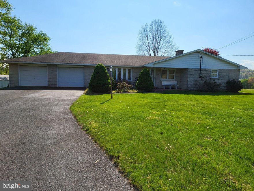 Escape to Serenity on 3+ Private Acres!
Nestled in the heart of Wayne Township, this sprawling brick ranch offers the perfect blend of classic comfort and rural tranquility. Imagine sipping your morning coffee on the expansive covered front porch before stepping inside to a floor plan designed for easy living. With over 3 acres of beautiful Pennsylvania countryside, this property is a rare find in the Halifax School District.

The heart of the home features both a spacious living room and a cozy family room, providing ample space for gatherings. Retreat to the large sunroom to enjoy panoramic views of your private estate regardless of the season. Storage and hobbies are a breeze with the oversized garage and a full basement featuring modest finished areas—perfect for a home gym, office, or workshop. If you’ve been looking for a solid brick home with room to breathe, your search ends here.