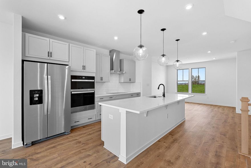 *NEW CONSTRUCTION* Special All-In Price, for June Move-In! Step into the Potomac, a superior 3-level luxury townhome with a 2-car garage in the sought-after Belmont Park community in Ashburn, VA. This thoughtfully designed home offers 4 bedrooms and 3.5 baths, all with 9 ft. ceilings for an open, airy feel. The gourmet kitchen is a showpiece, featuring upgraded off-white cabinets with black hardware, quartz countertops, ceramic tile backsplash, range hood, and stainless-steel Whirlpool appliances. Designer laminate flooring flows throughout the main level, including the kitchen, walk-in pantry, dining room and great room. The luxurious primary suite includes a generous walk-in closet and a spa-inspired bathroom with raised double vanities, quartz countertops, and a shower with designer ceramic tile. Get special pricing and $20K in Closing Costs until 3/11 (restrictions apply; see New Home Counselor for details).* Hometown heroes get $2,500 (restrictions apply; see New Home Counselor for details). Plus, the garage includes an EV charger-compatible outlet, making this home future-ready. Enjoy low-maintenance living with snow removal, lawn care, and exterior upkeep all handled for you—giving you more time to enjoy life. Belmont Park offers resort-style amenities including bocce ball, volleyball, playgrounds, and community greenspaces. These advanced performance homes save you money on utilities while reducing your carbon footprint. These homes are DOE Zero Energy Ready Homes™, built for efficiency and sustainability. Located in Ashburn, you’ll have quick access to major roadways, Dulles Airport, and endless dining and entertainment options like Cooper’s Hawk Winery and TopGolf. Photos of similar home. Model Home Hours: Mon–Sun, 11 AM–6PM. Use 19774 Sepia Square, Ashburn, VA 20147 for GPS direction.